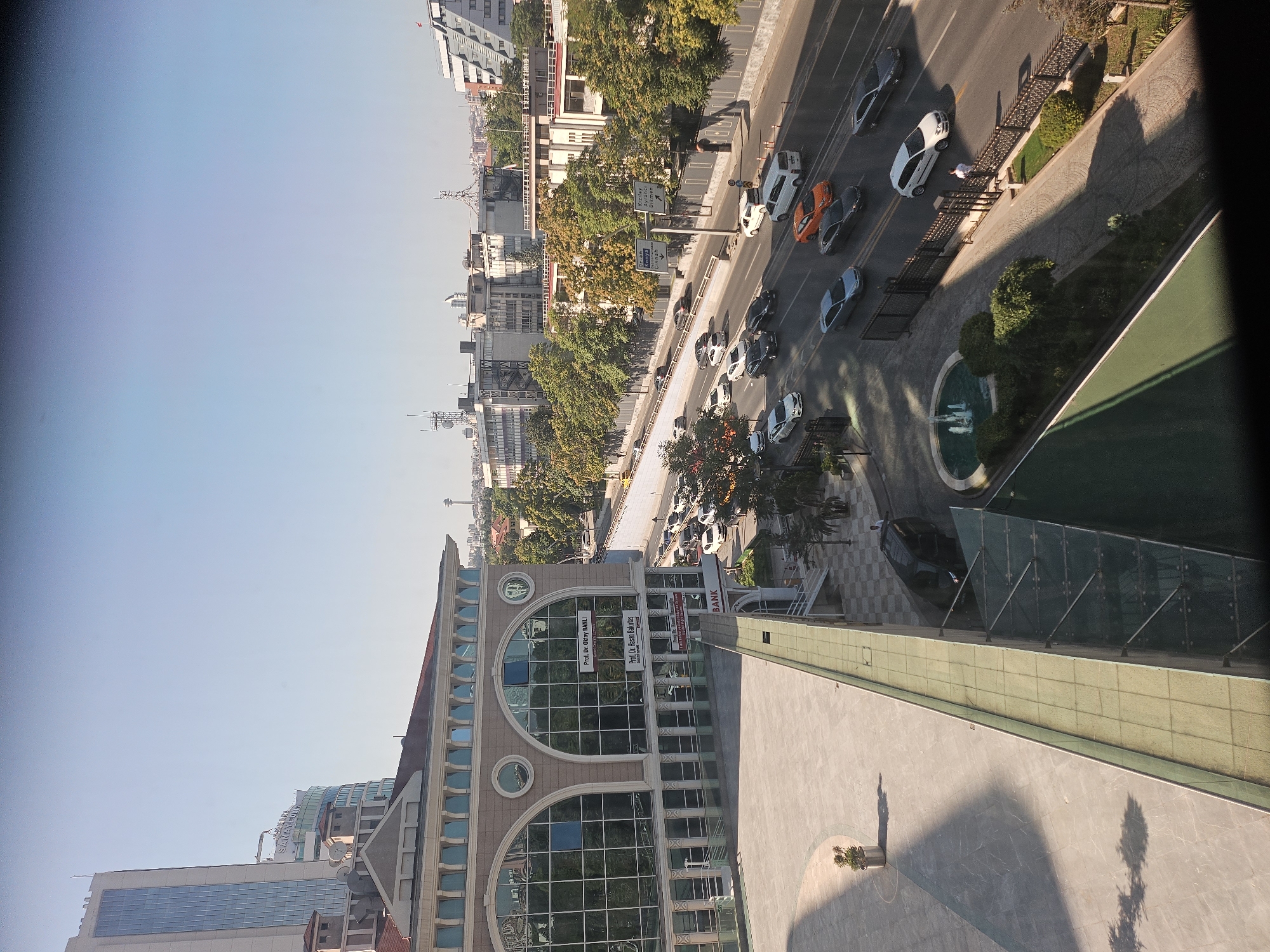 City street traffic and hotel room details, same morning