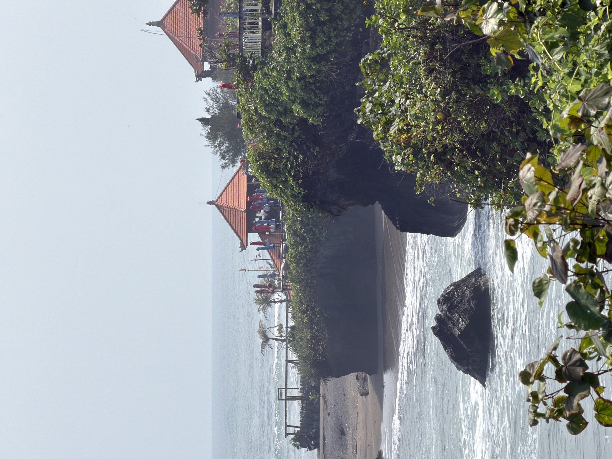 Tanah Lot coastline: sea temple, stone turtles, and volcanic shores