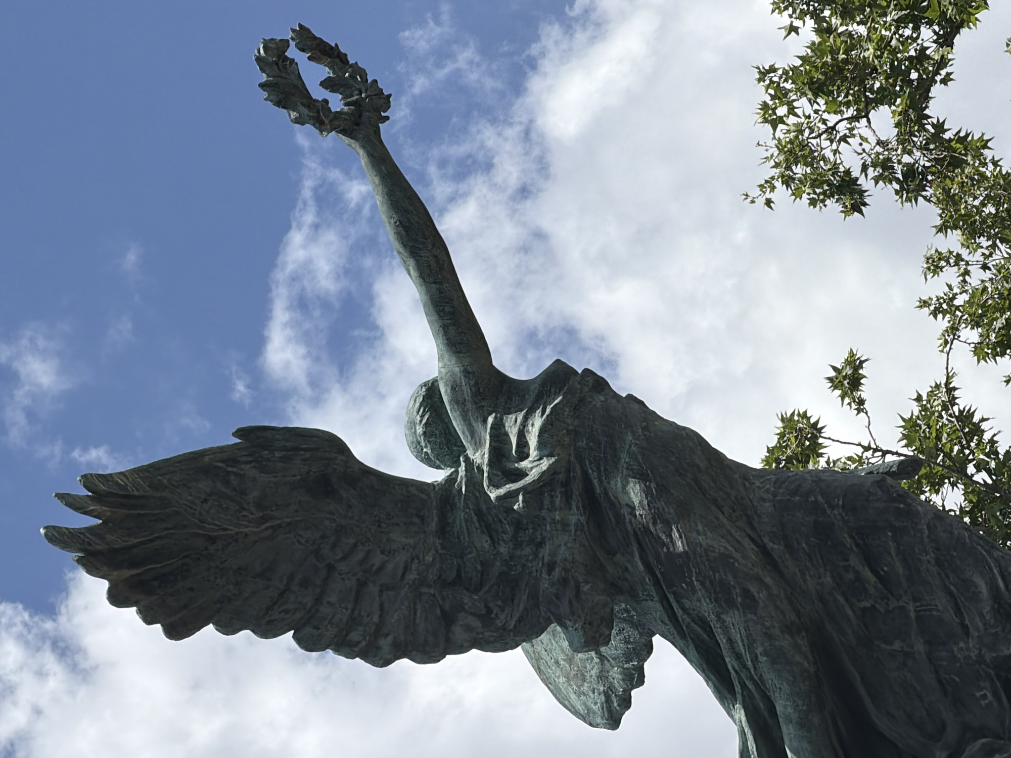 Tourist documents baroque sculptures and bronze statuary in Rome