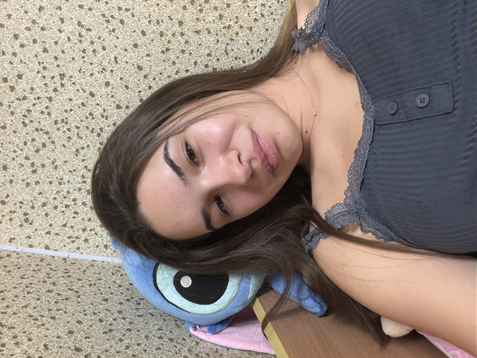 Woman resting at home with stuffed animals in Sofia