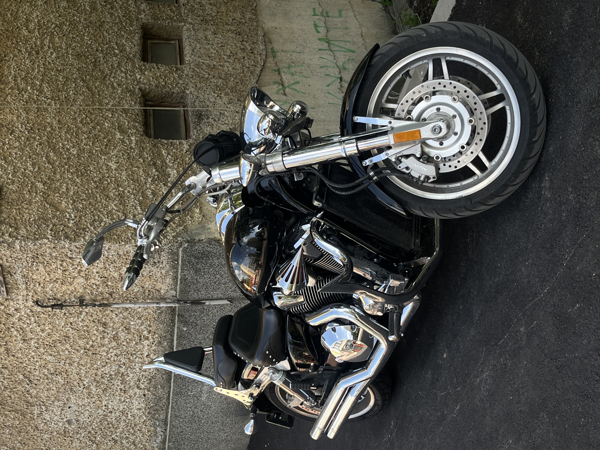 Motorcycle parked near old building in Gabrovo, Bulgaria