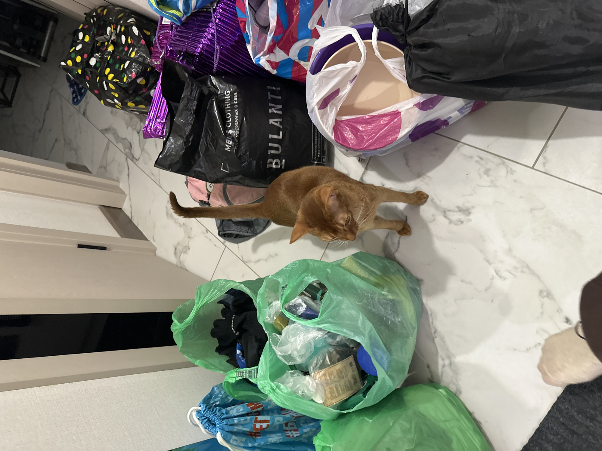 Colorful shopping bags scattered on marble floor in Kazan