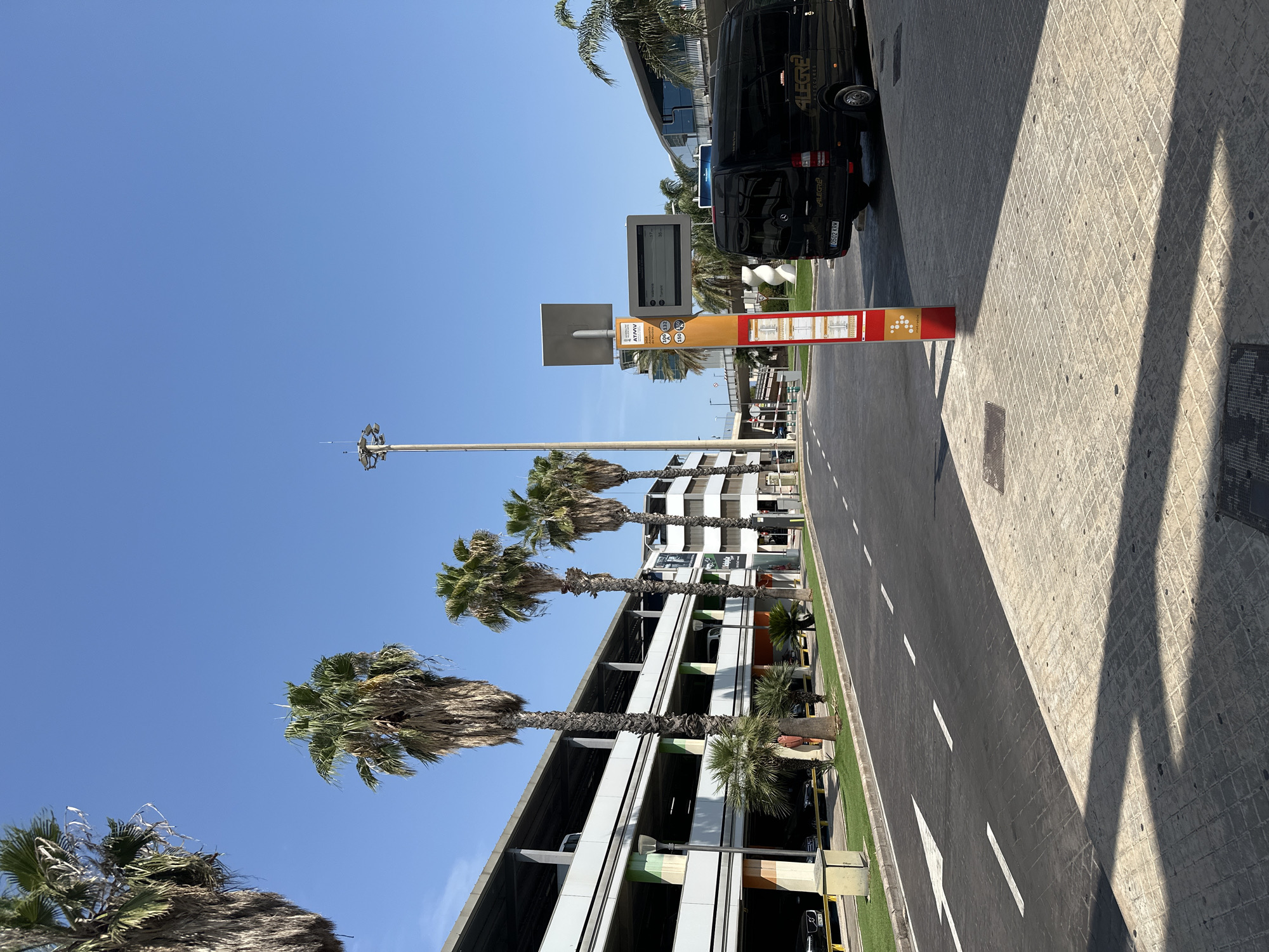 Around Valencia Airport's exterior on a sunny July afternoon