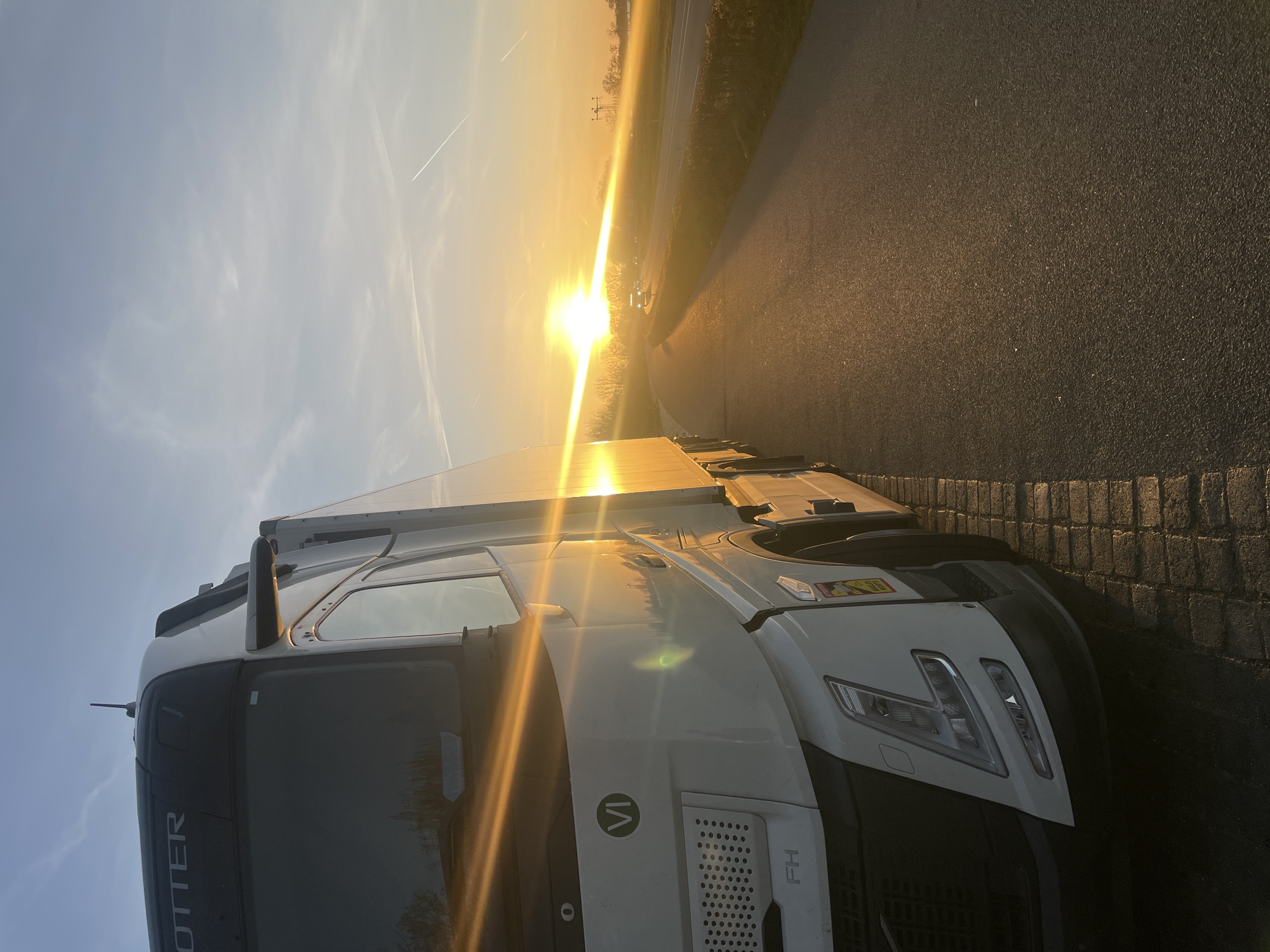 White truck parked in Volkel during late afternoon sun