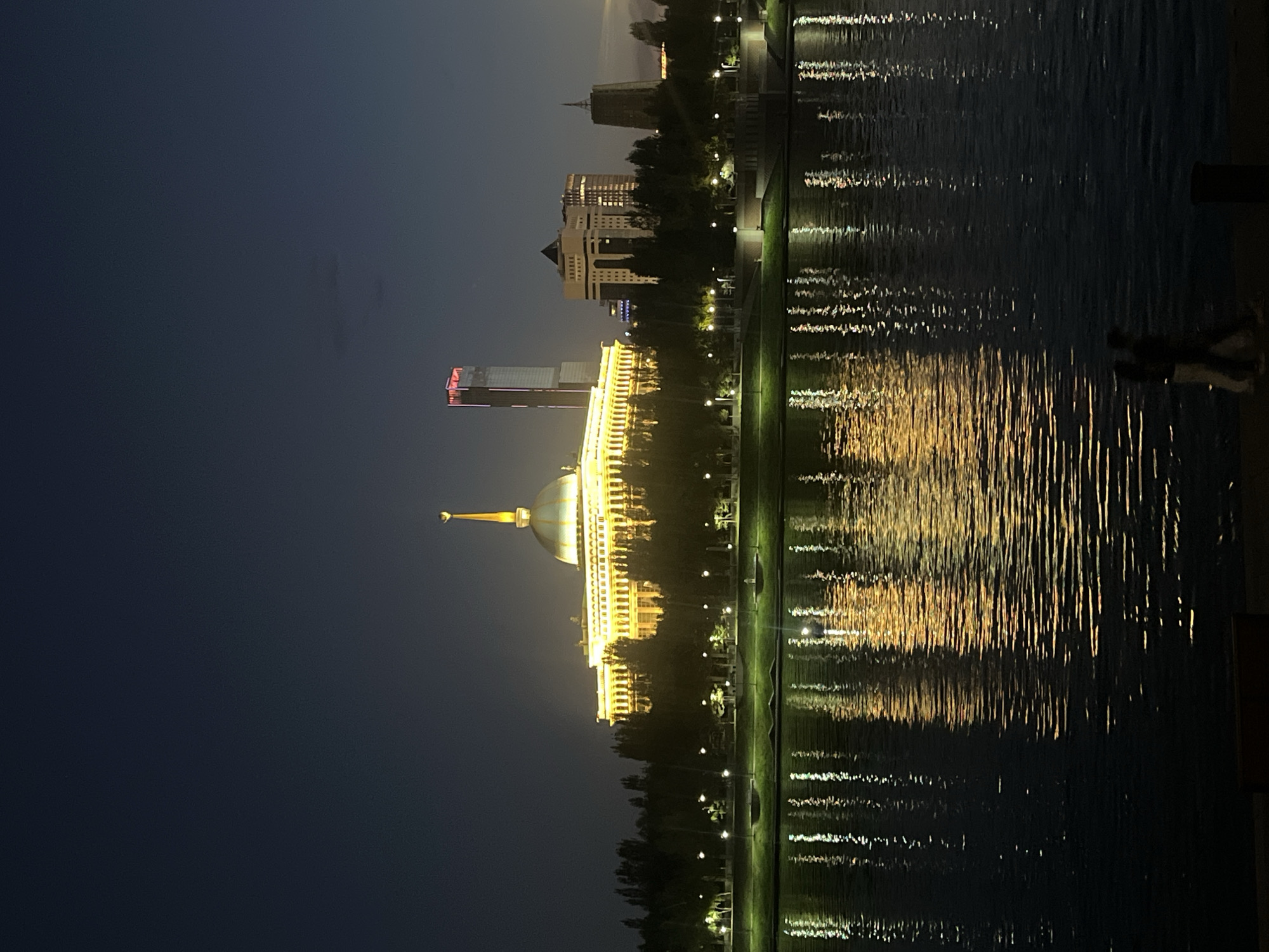 Astana at night: Bayterek monument and waterfront reflections