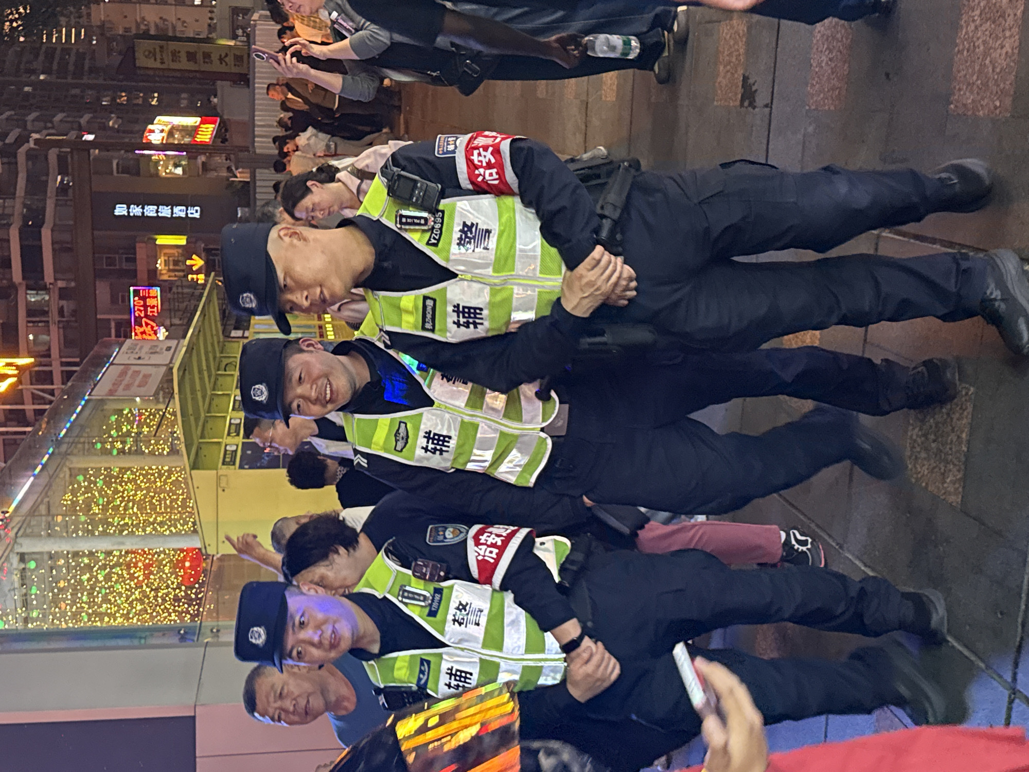 Tourists photograph public art and landmarks in Chongqing district
