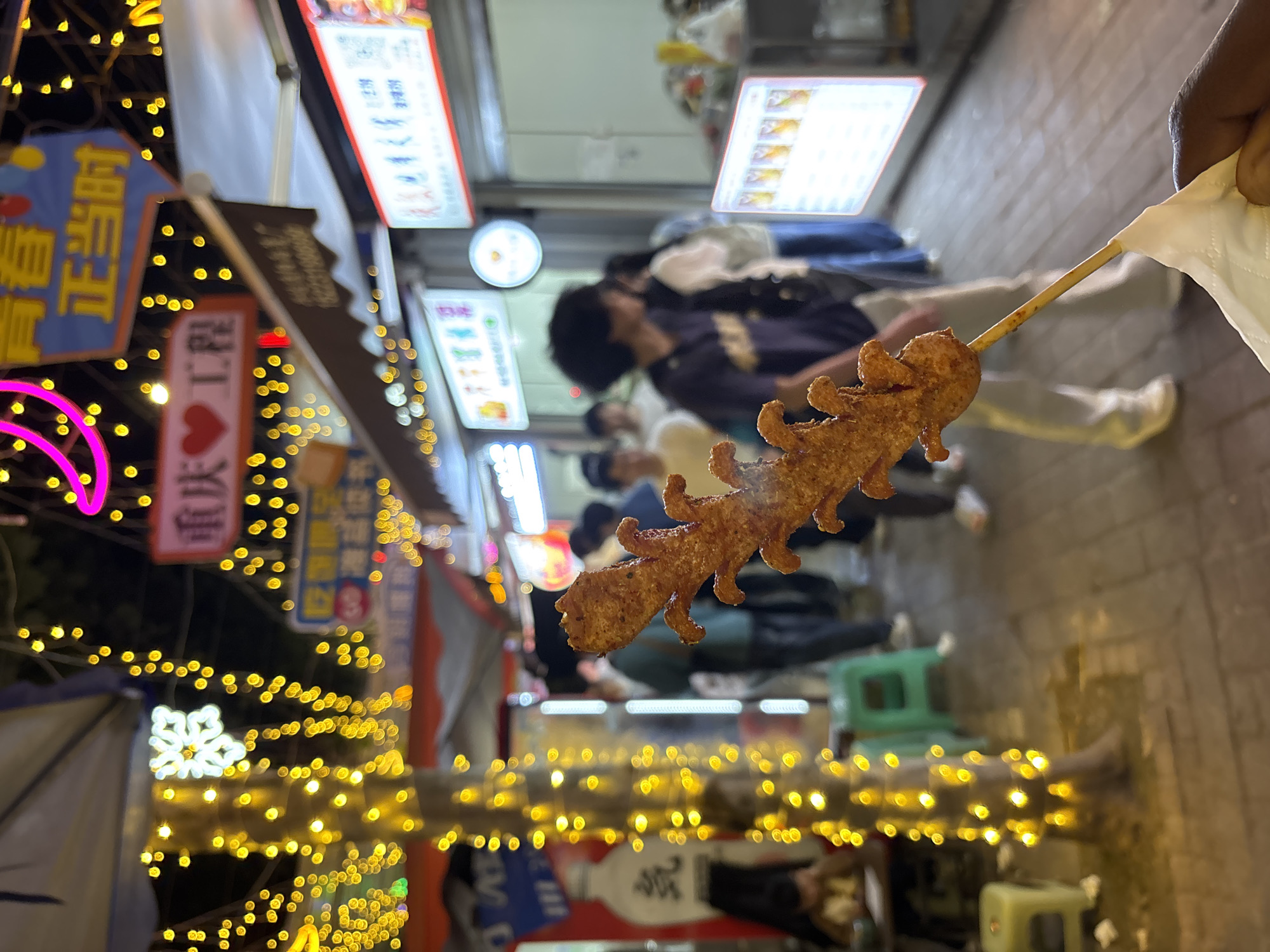 Evening street food market activity documented in Jiangjin, China