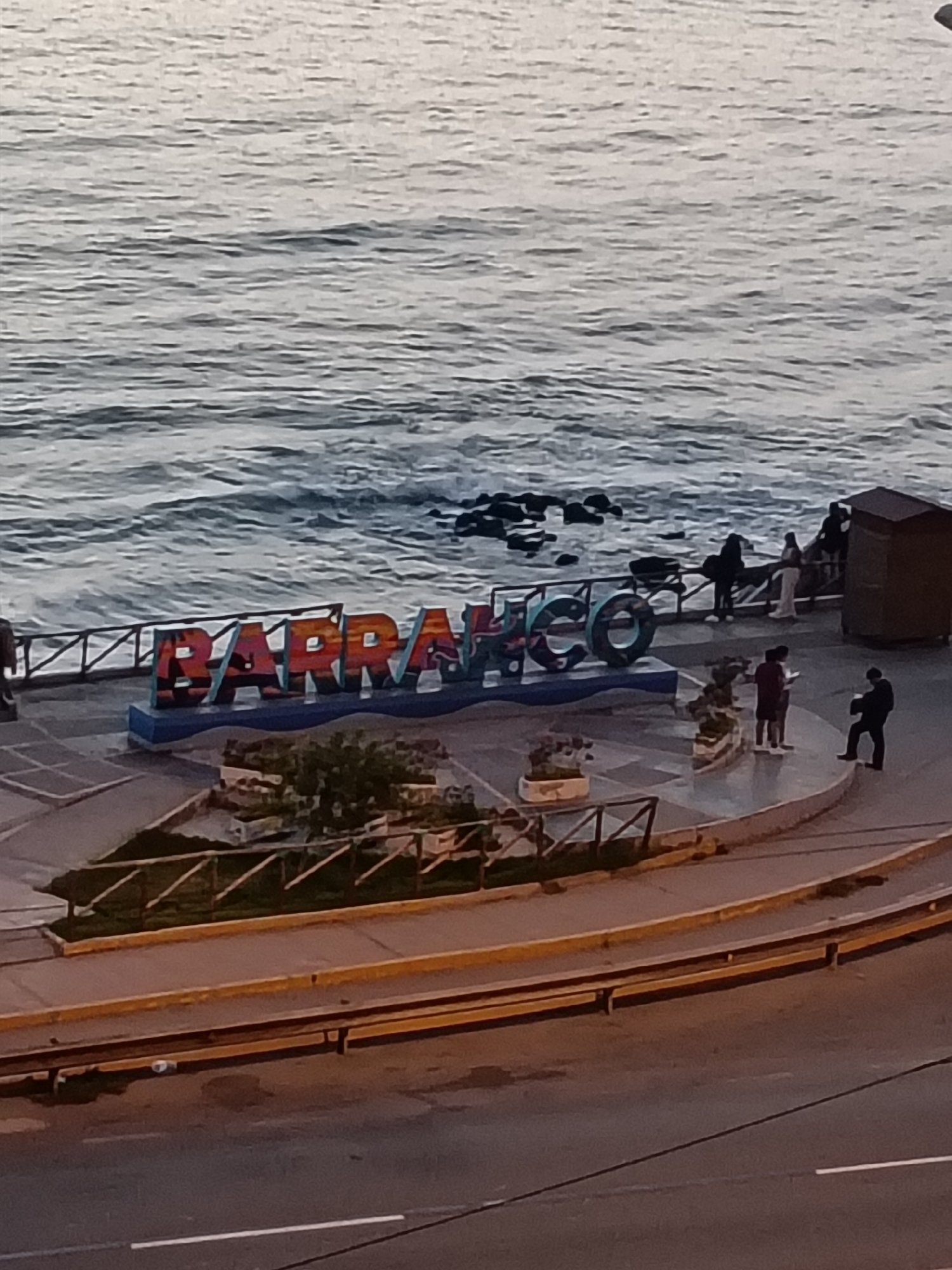 Tourist captures Barranco's street art and landmarks during evening walk
