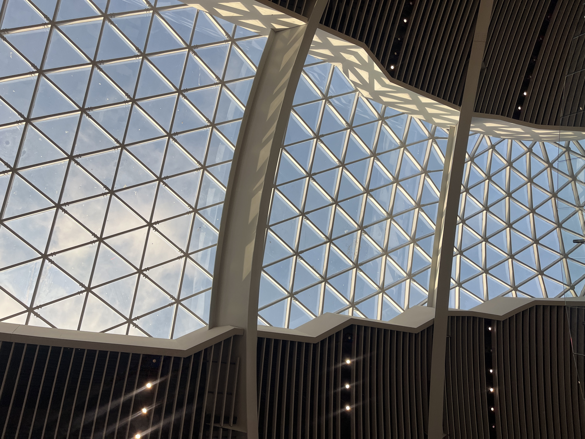 Curved glass ceiling architecture documented in Fiumicino, Italy