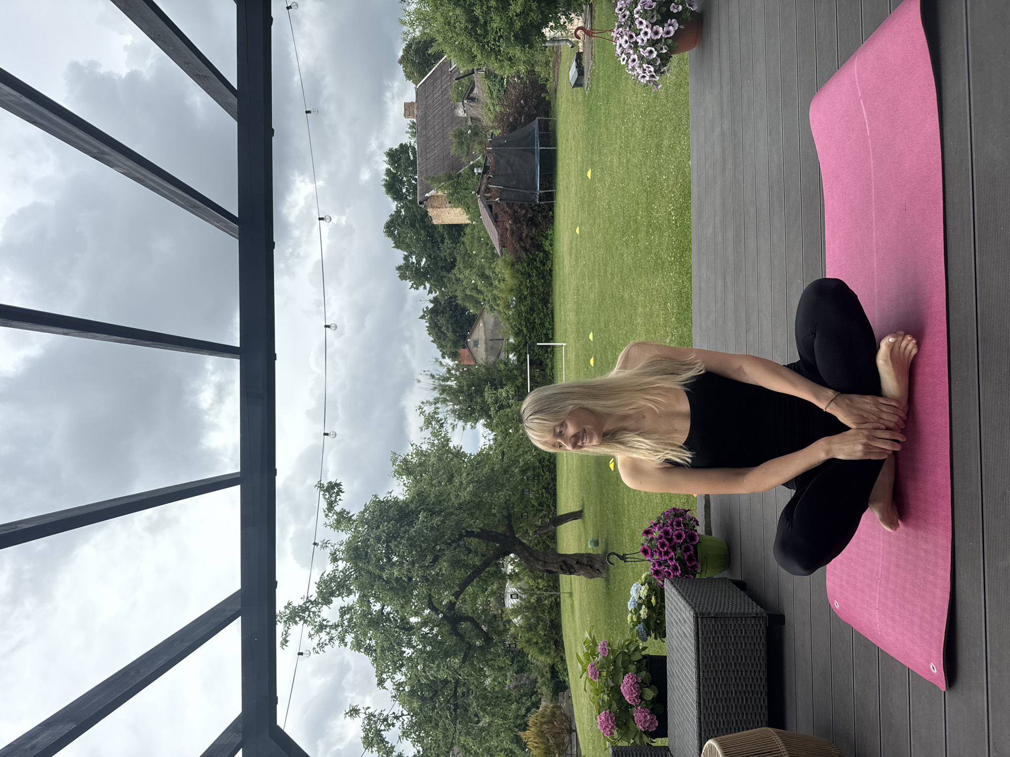 Morning yoga session captured on wooden deck in Carnikava