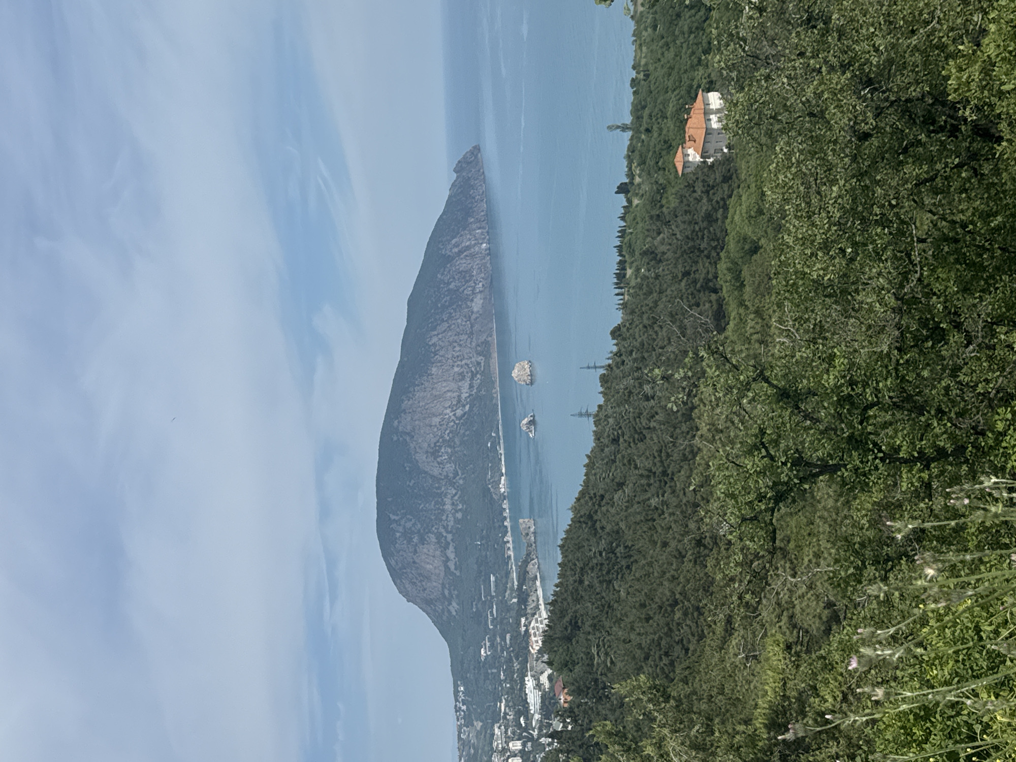 Tourist captures scenic moments in Gurzuf's mountainous coastal landscape