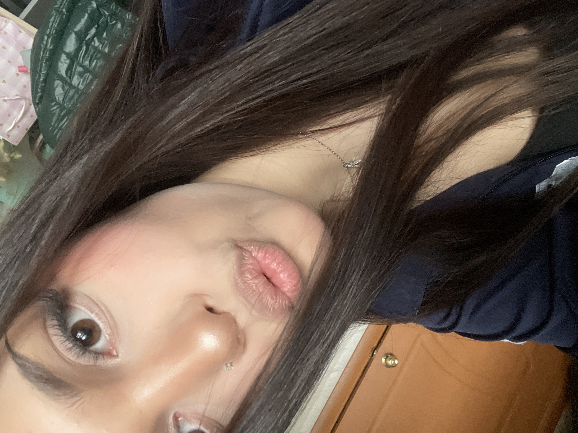 Woman takes multiple selfies indoors in Vsevolozhsk, Russia