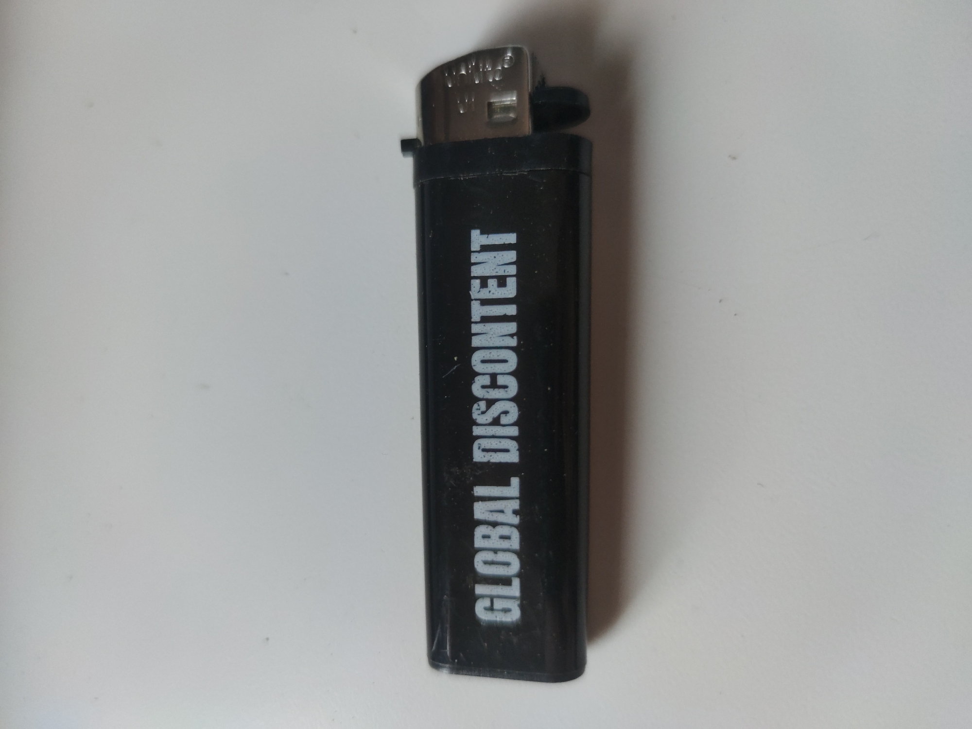 Collection of themed lighters documented on white surface