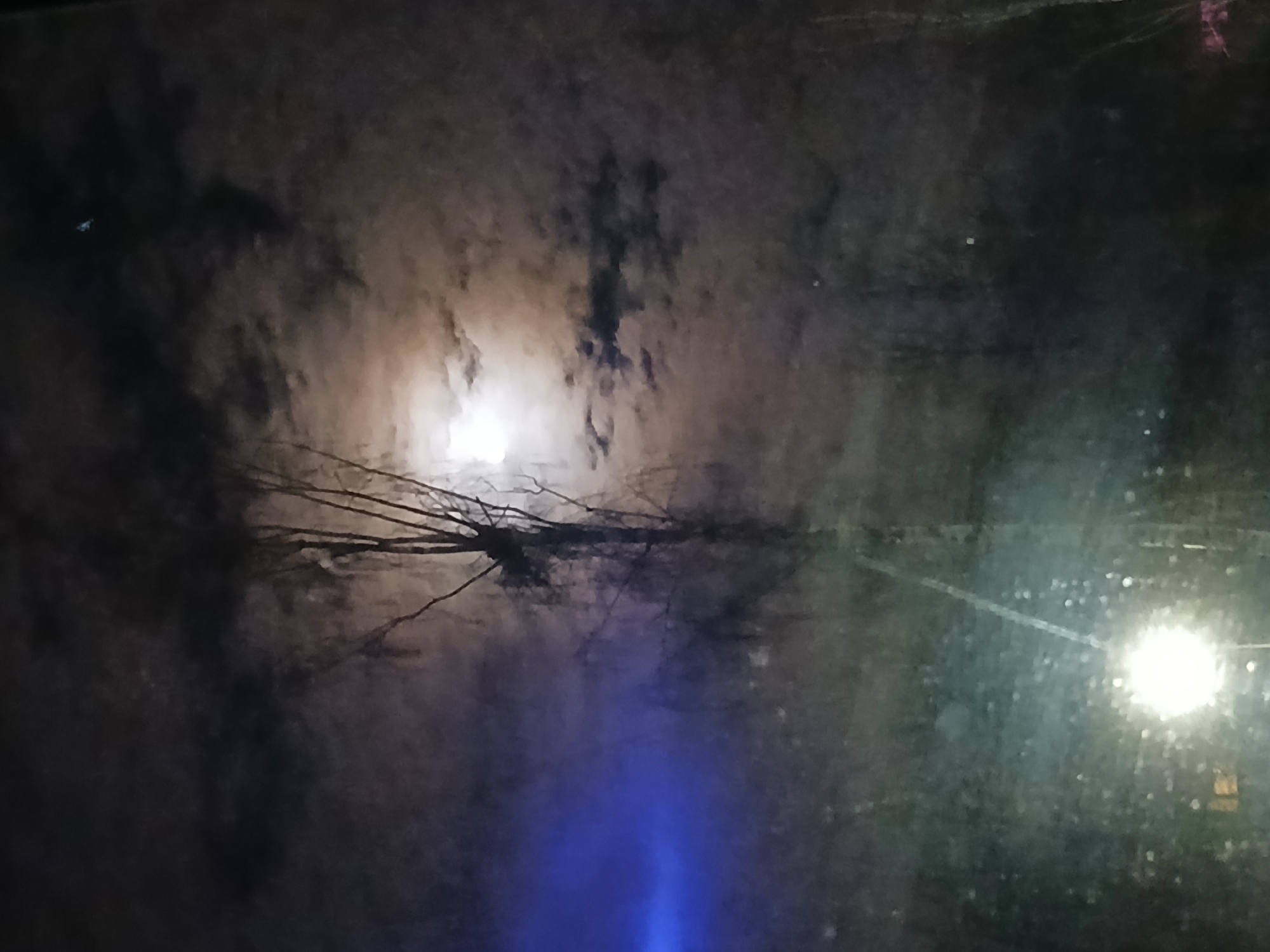 Bright moon observed through window on April evening