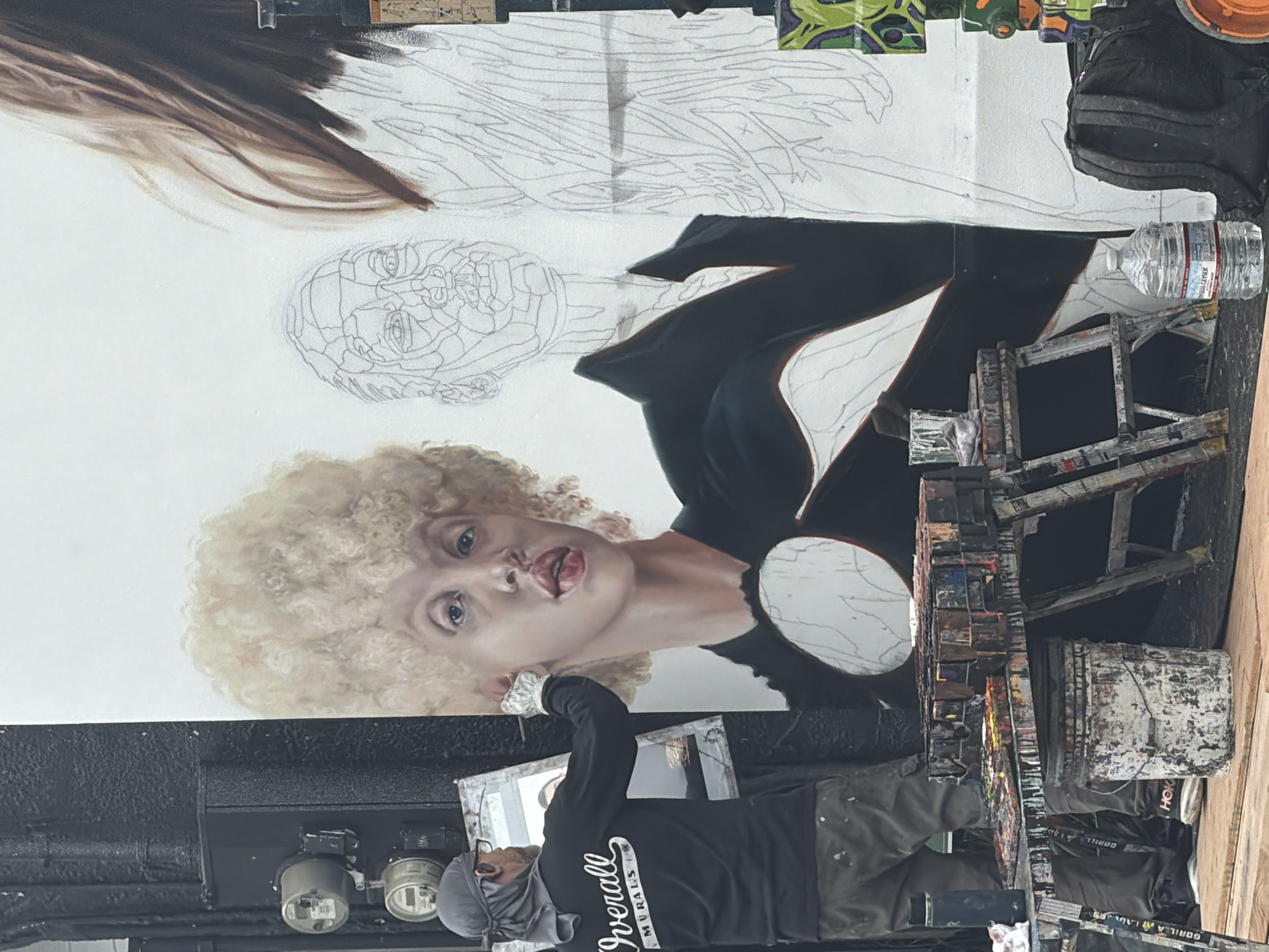 Artist paints woman's portrait mural on Los Angeles building