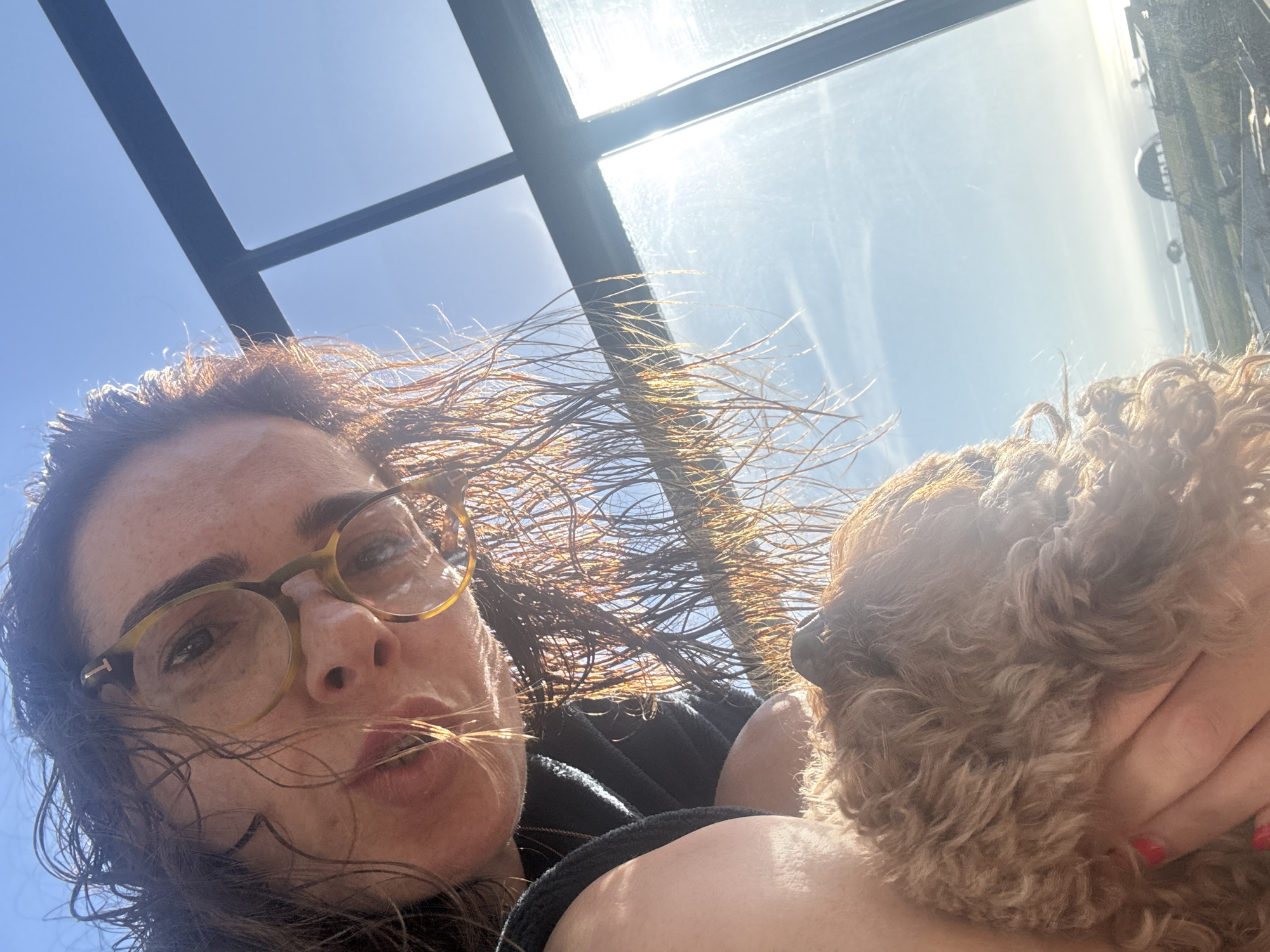 Woman takes morning selfie with dog in Loures