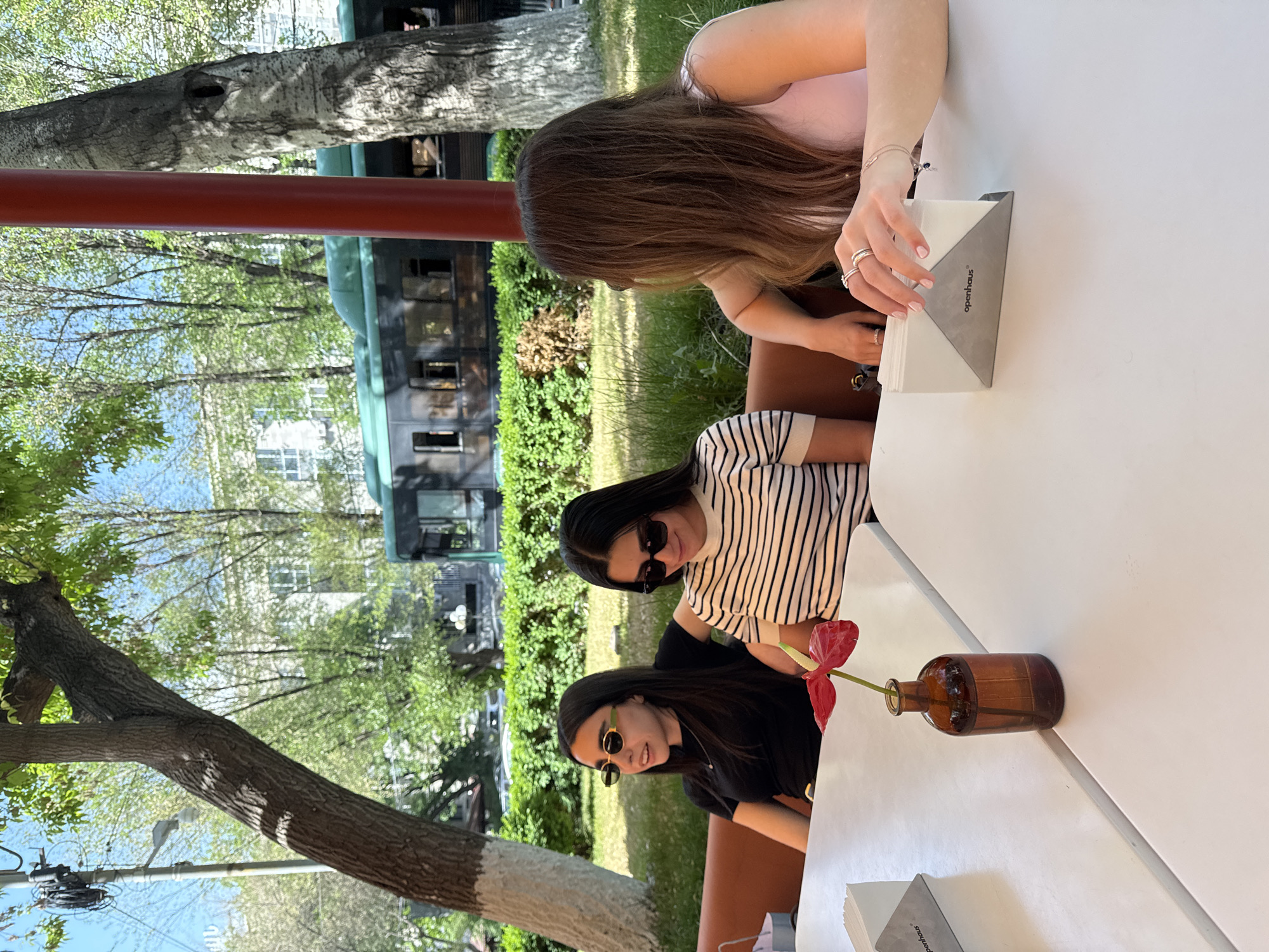Women share midday meal at flower-decorated Yerevan cafe