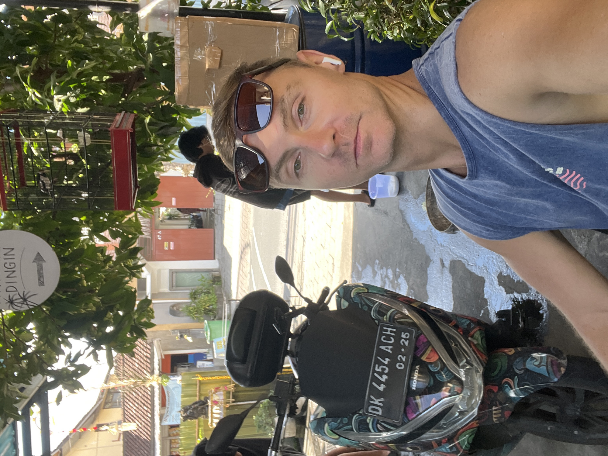 Motorcycle wash session underway at a North Kuta service spot