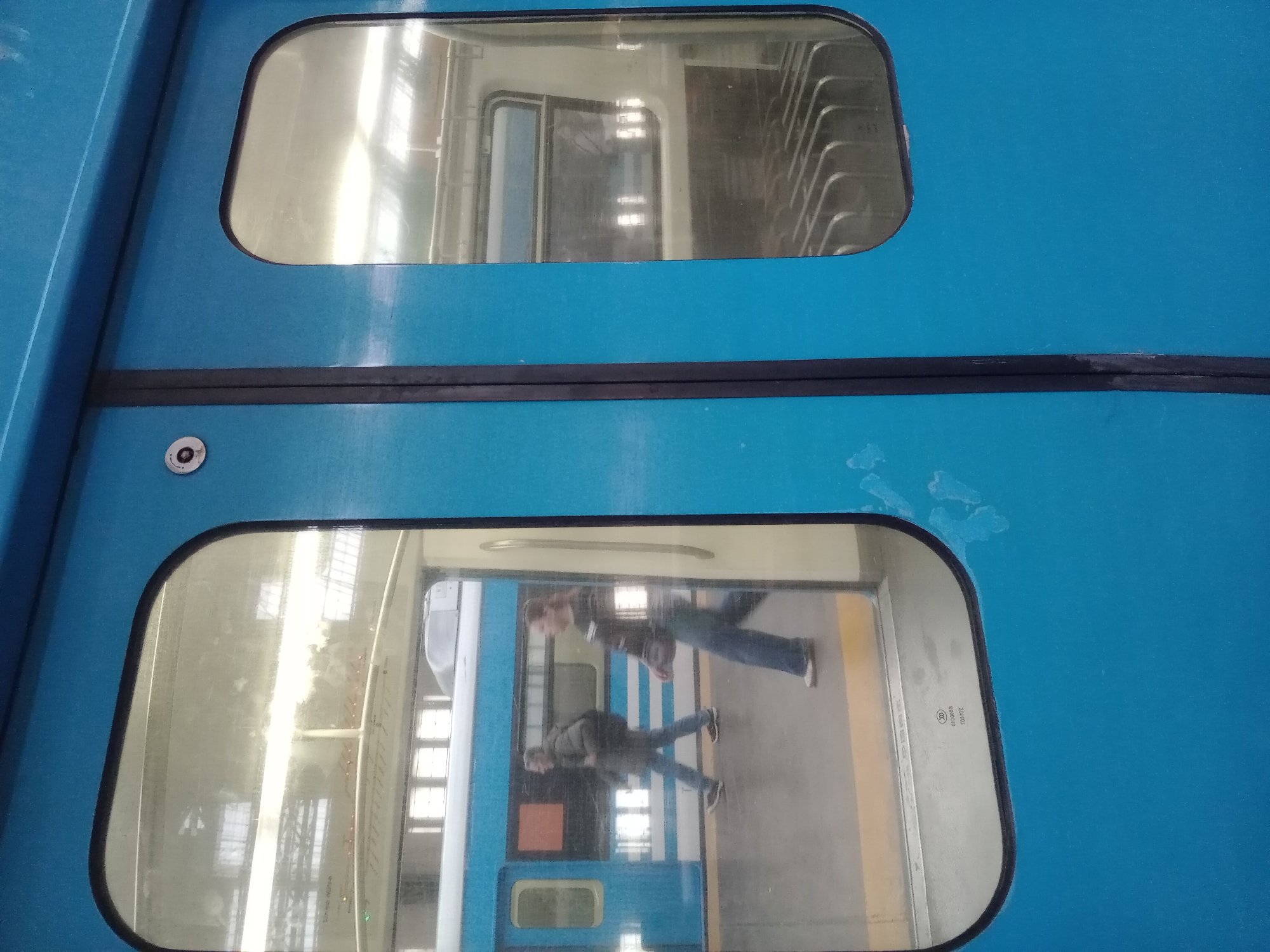 Evening commuter train operations documented at urban transit station
