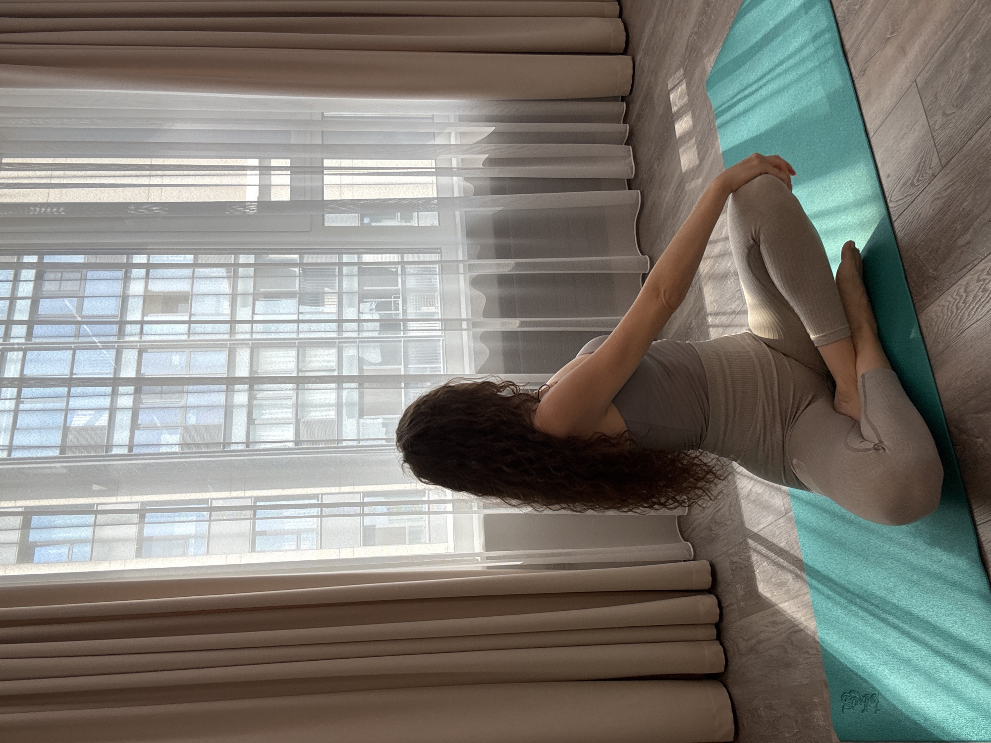 Quiet yoga session on a turquoise mat, Khimki home