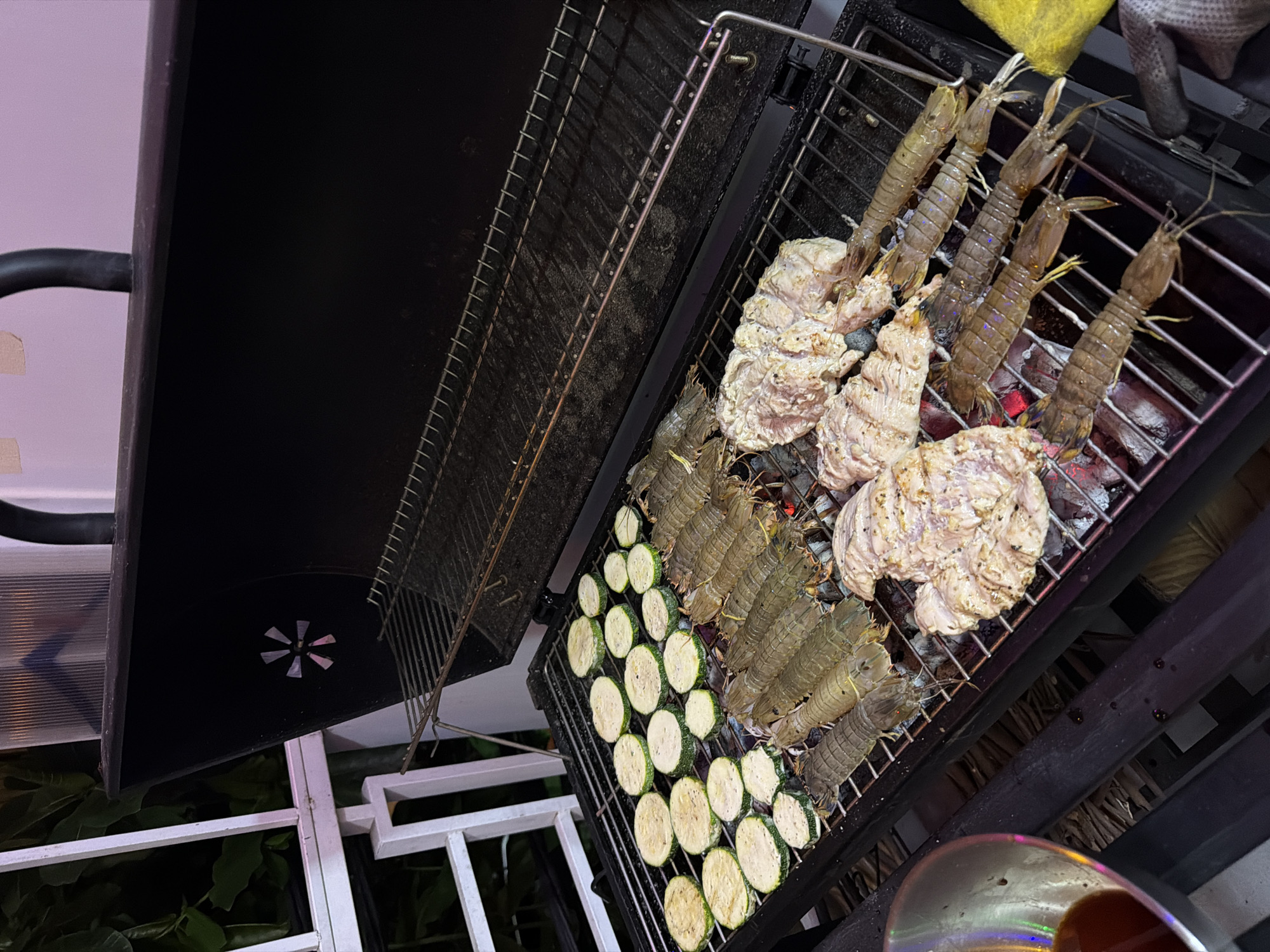 Outdoor barbecue session with seafood and vegetables in Nha Trang