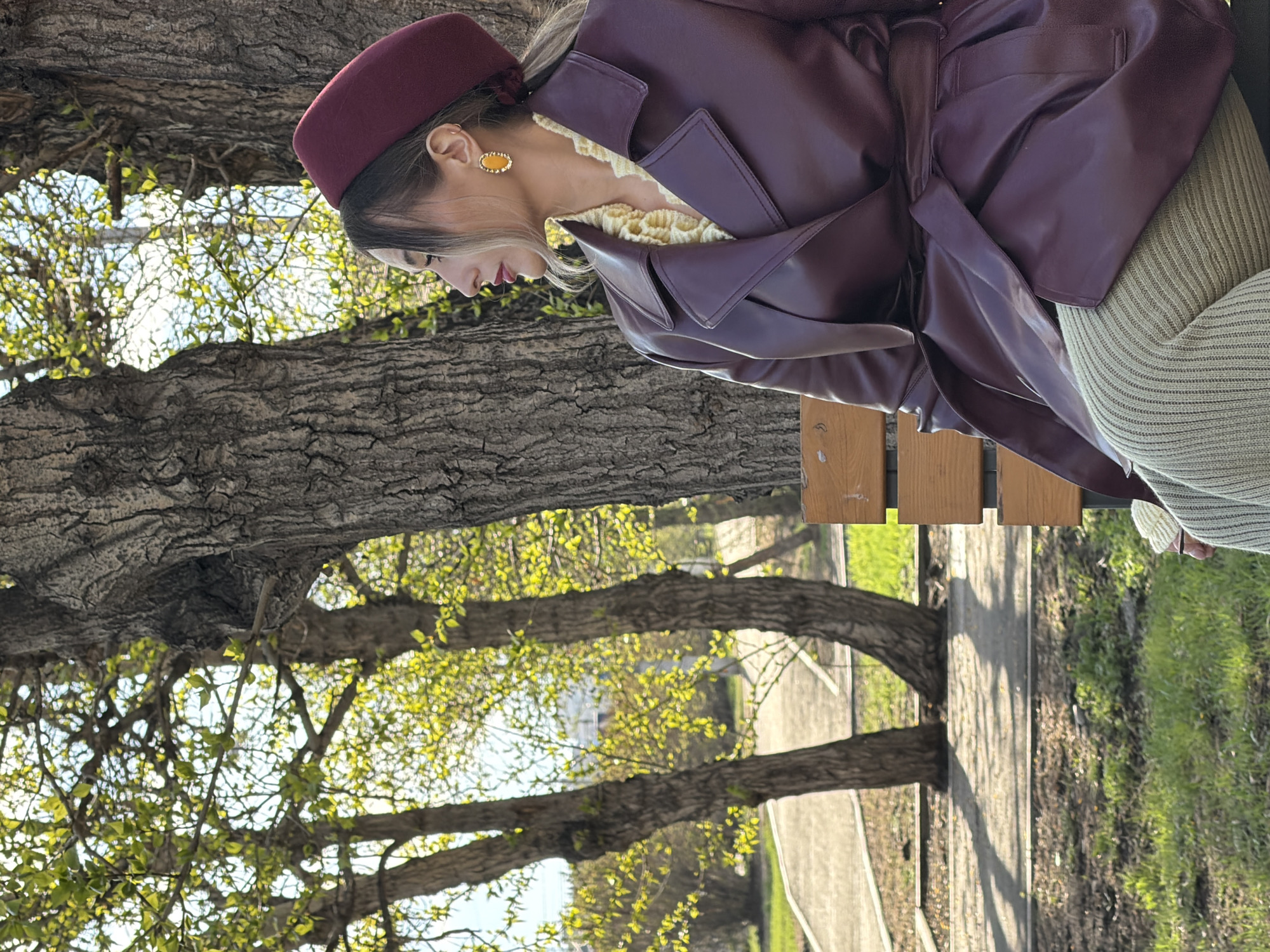 Woman in burgundy beret photographed in Krasnoyarsk park