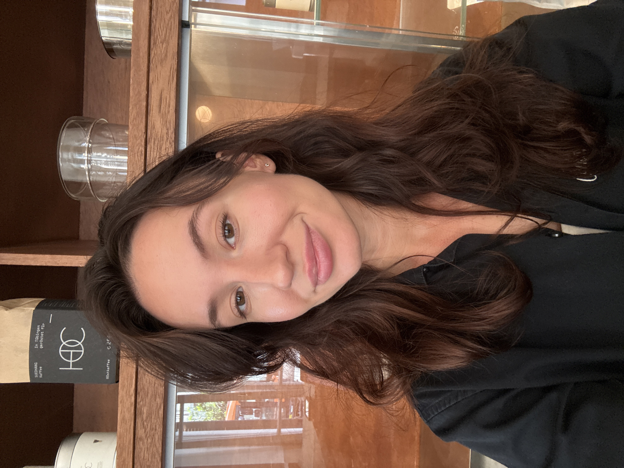 Selfie in front of wooden shelves in Tel Aviv