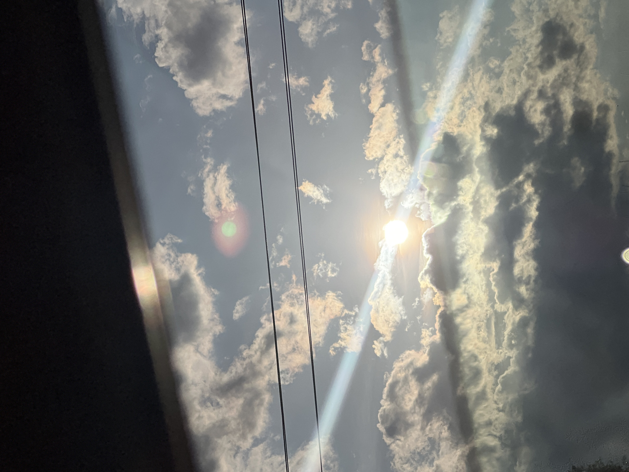 Bright afternoon sun creates dramatic lens flares over Pesnopoy