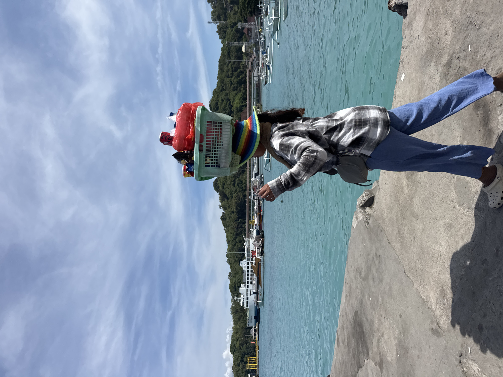 Morning ferry and tourist activity documented in Manggis harbor