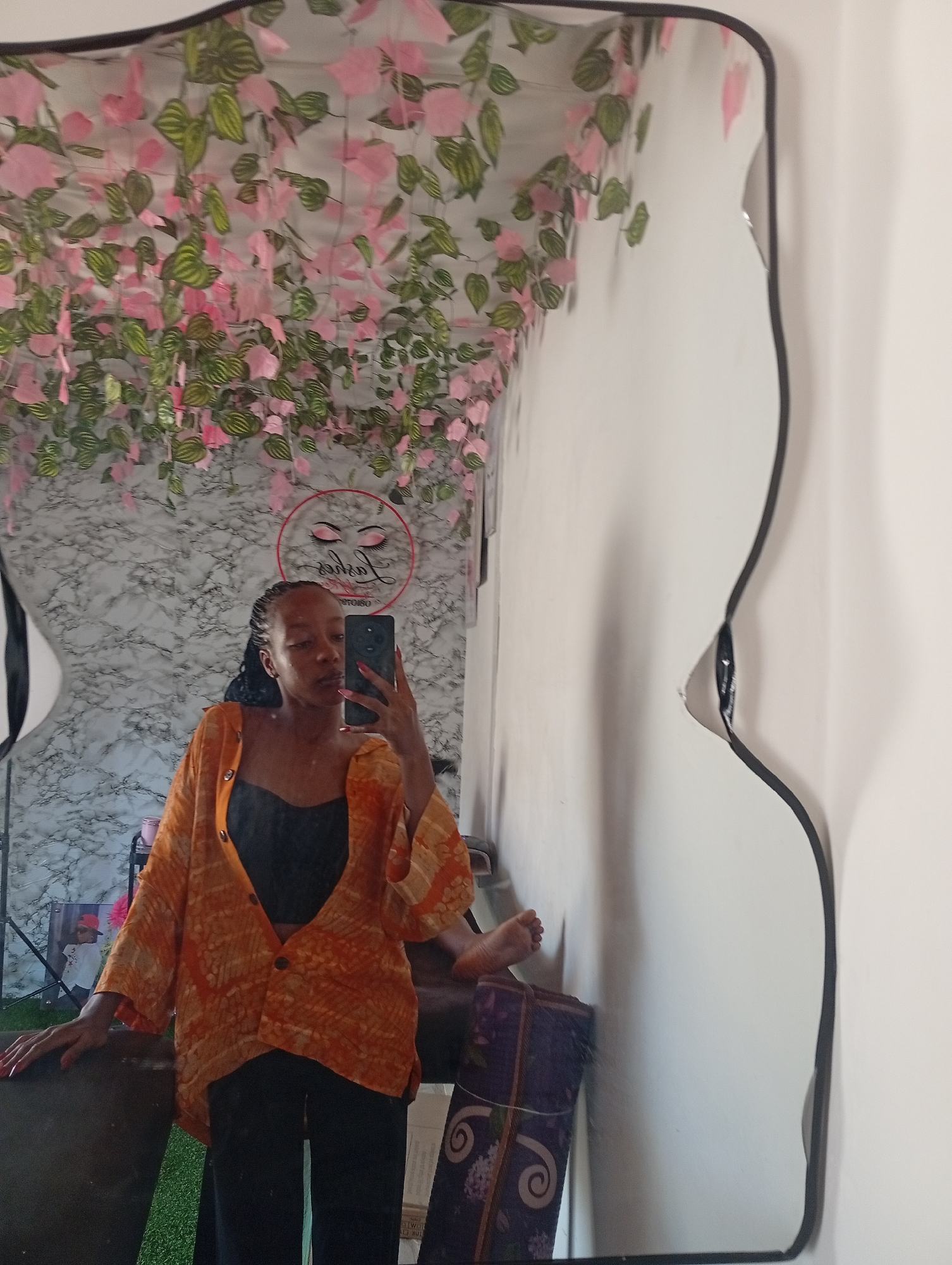 Woman Takes Selfies in Decorated Room in Narayi, Nigeria