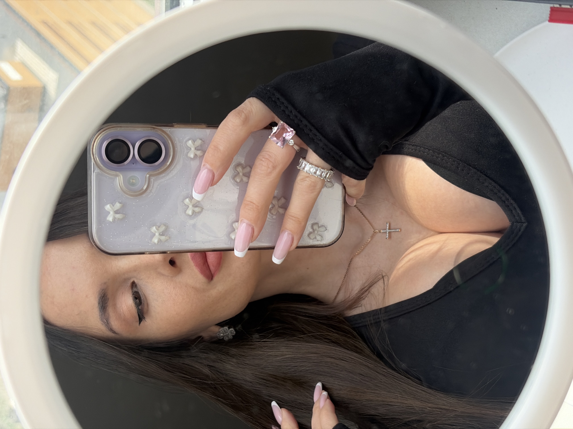 Woman takes mirror selfies in Saint Petersburg bedroom