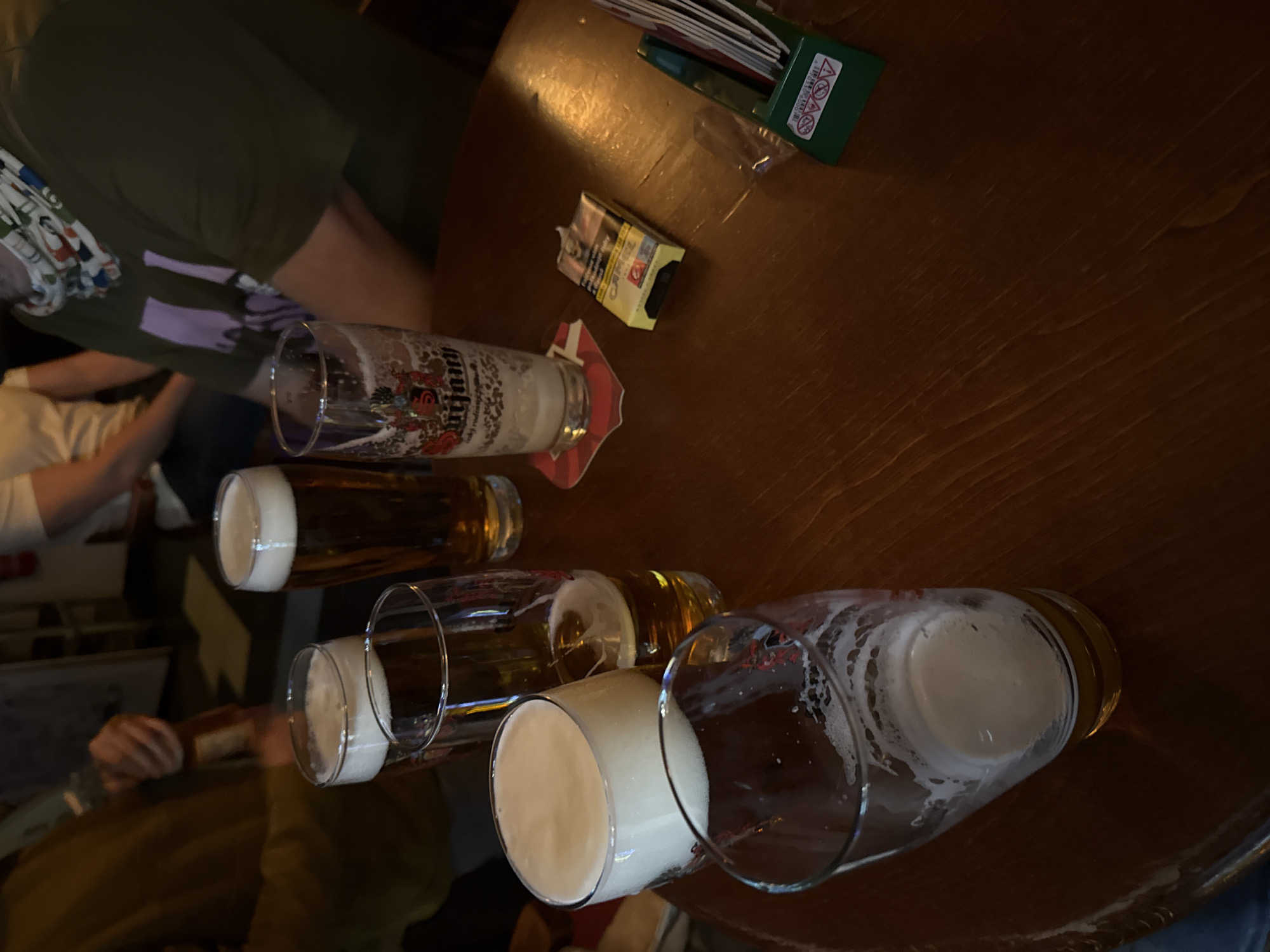 Evening social gathering at colorful glass-block bar in Trnava
