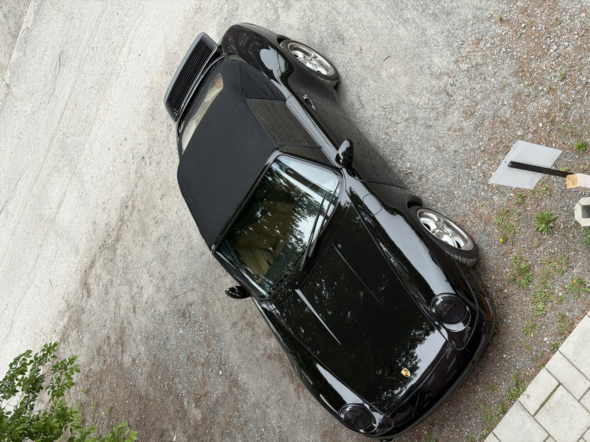 Black Porsche convertible spotted parked in Montreal evening