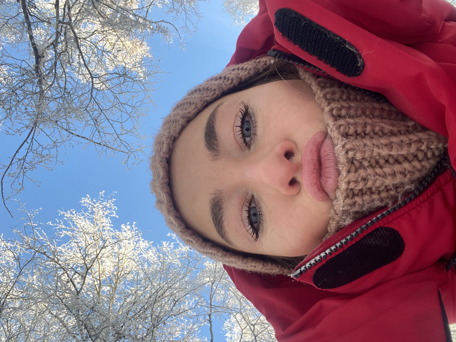 Woman takes winter selfies in sunny Ust-Ilimsk morning
