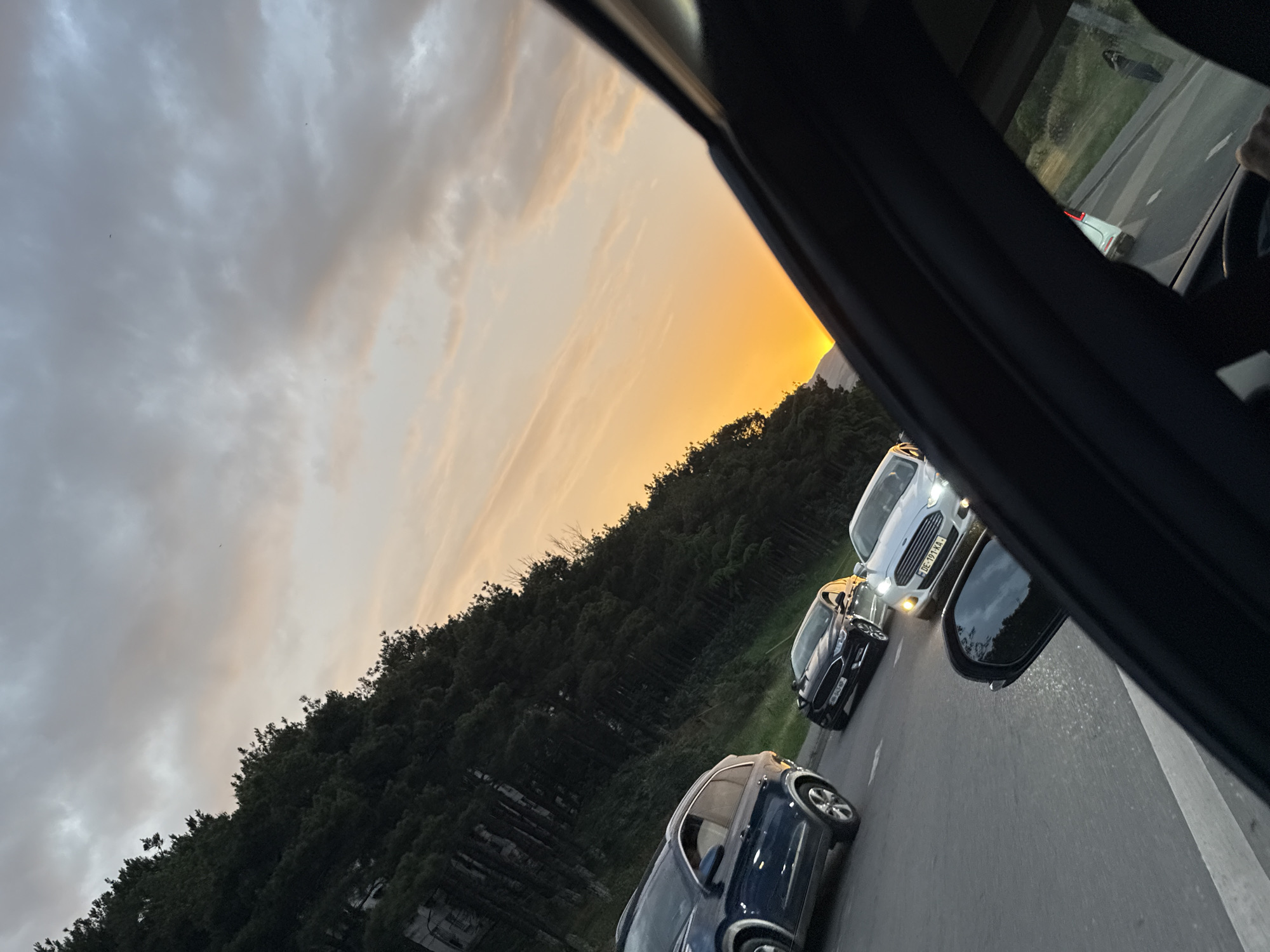 Tbilisi evening commute through a construction-heavy corridor at sunset