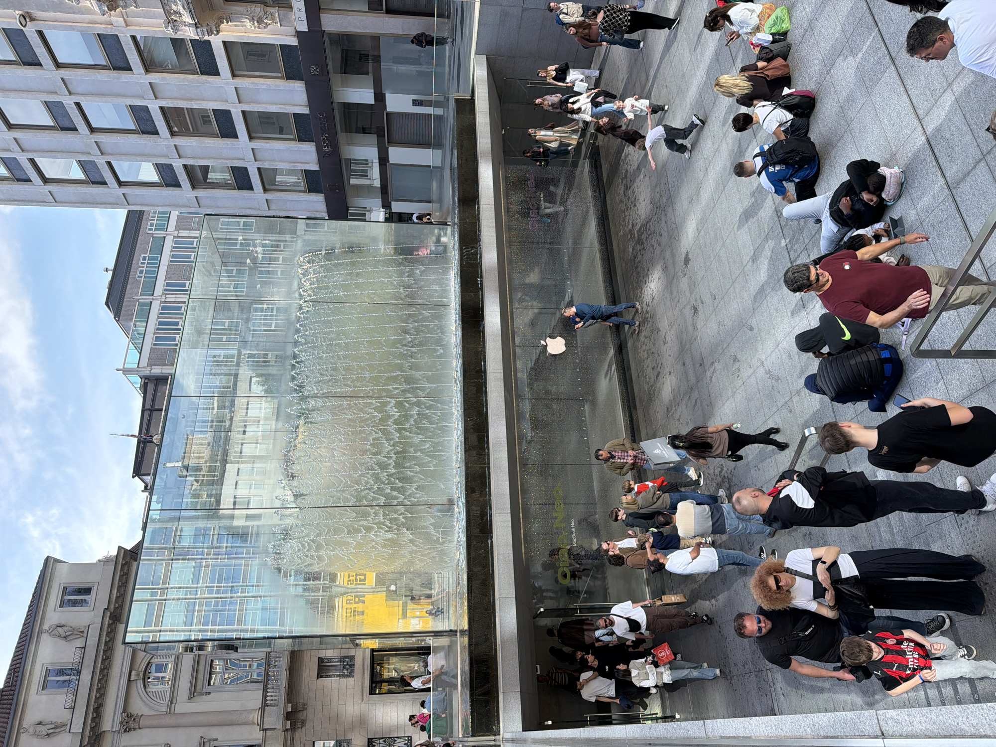 Crowd waits outside Milan Apple Store for product release