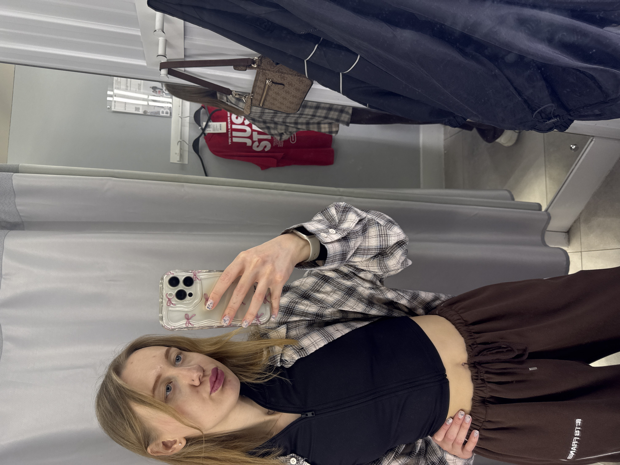 Woman takes fitting room selfies during shopping trip in Bataysk