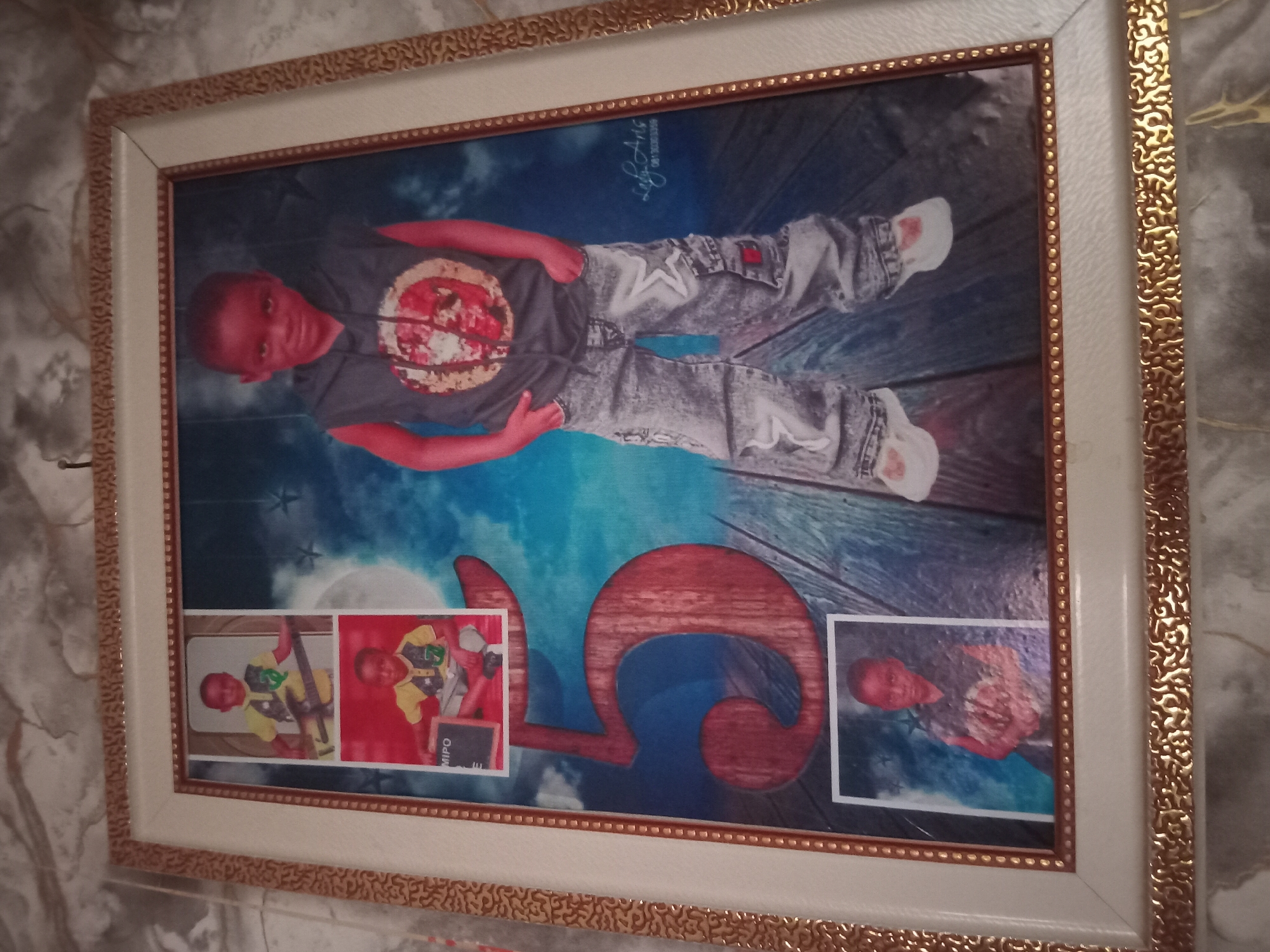 Boy builds cardboard model in decorated room, Shagamu Nigeria
