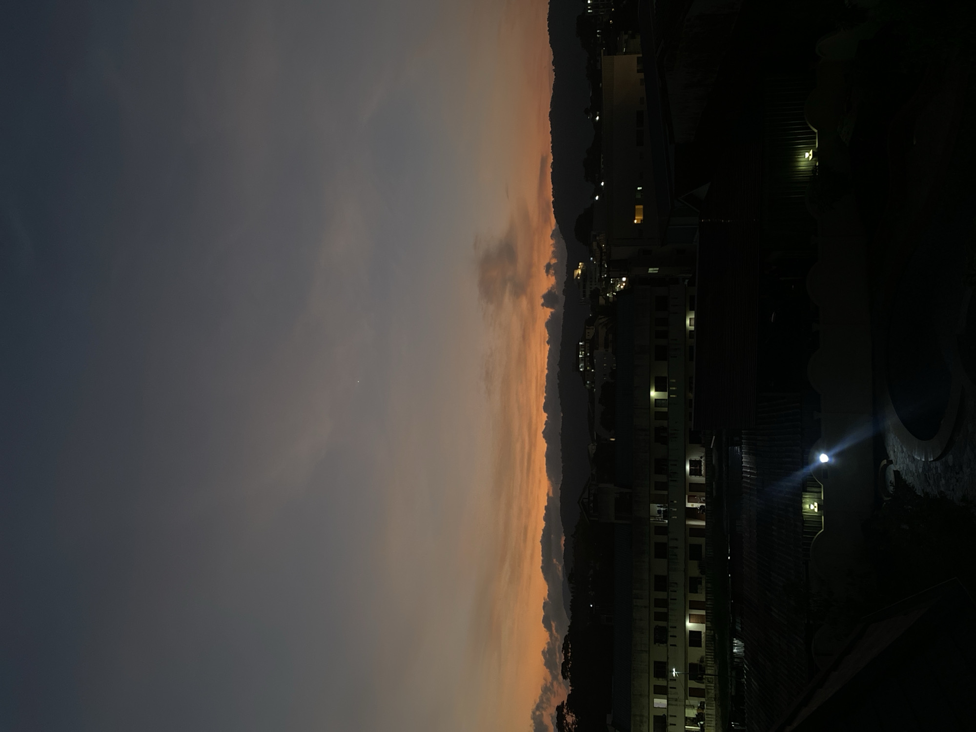 Dusk sky with orange-gray gradient observed over Ratsada, Thailand