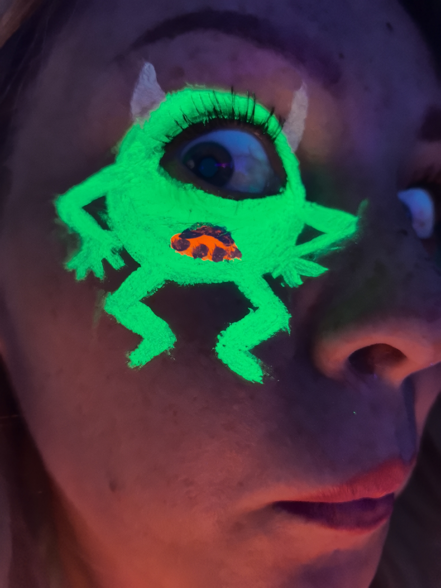 Person experiments with UV makeup in Noviy, Russia