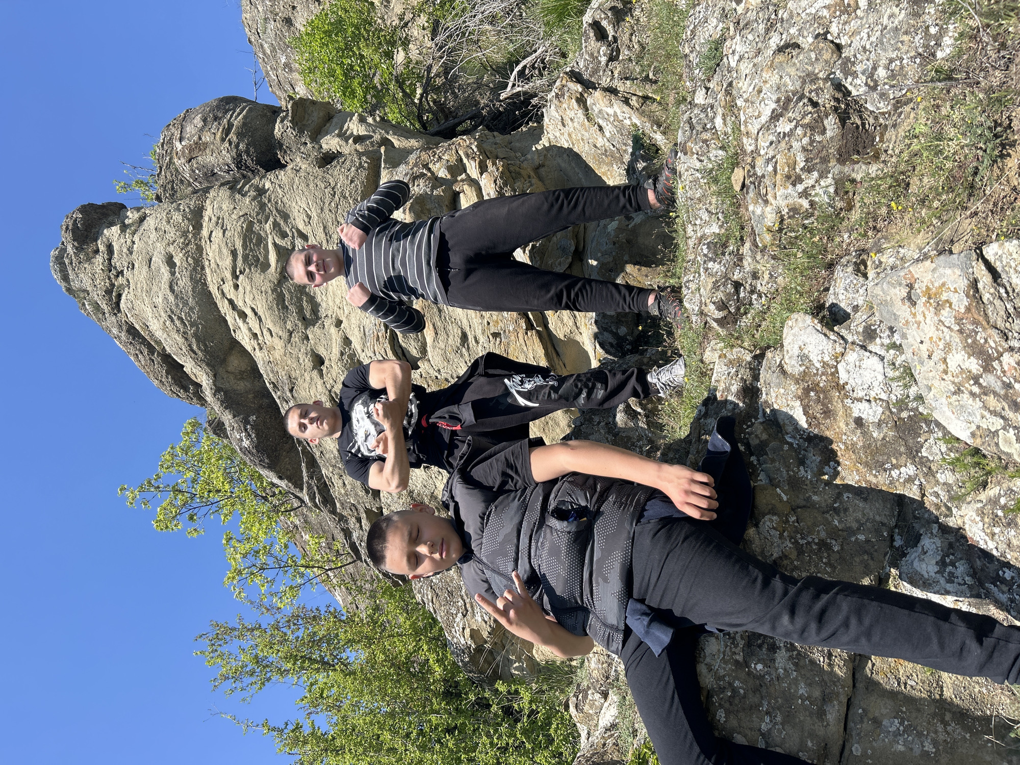 Young men pose at scenic overlook in Goritsa, Bulgaria