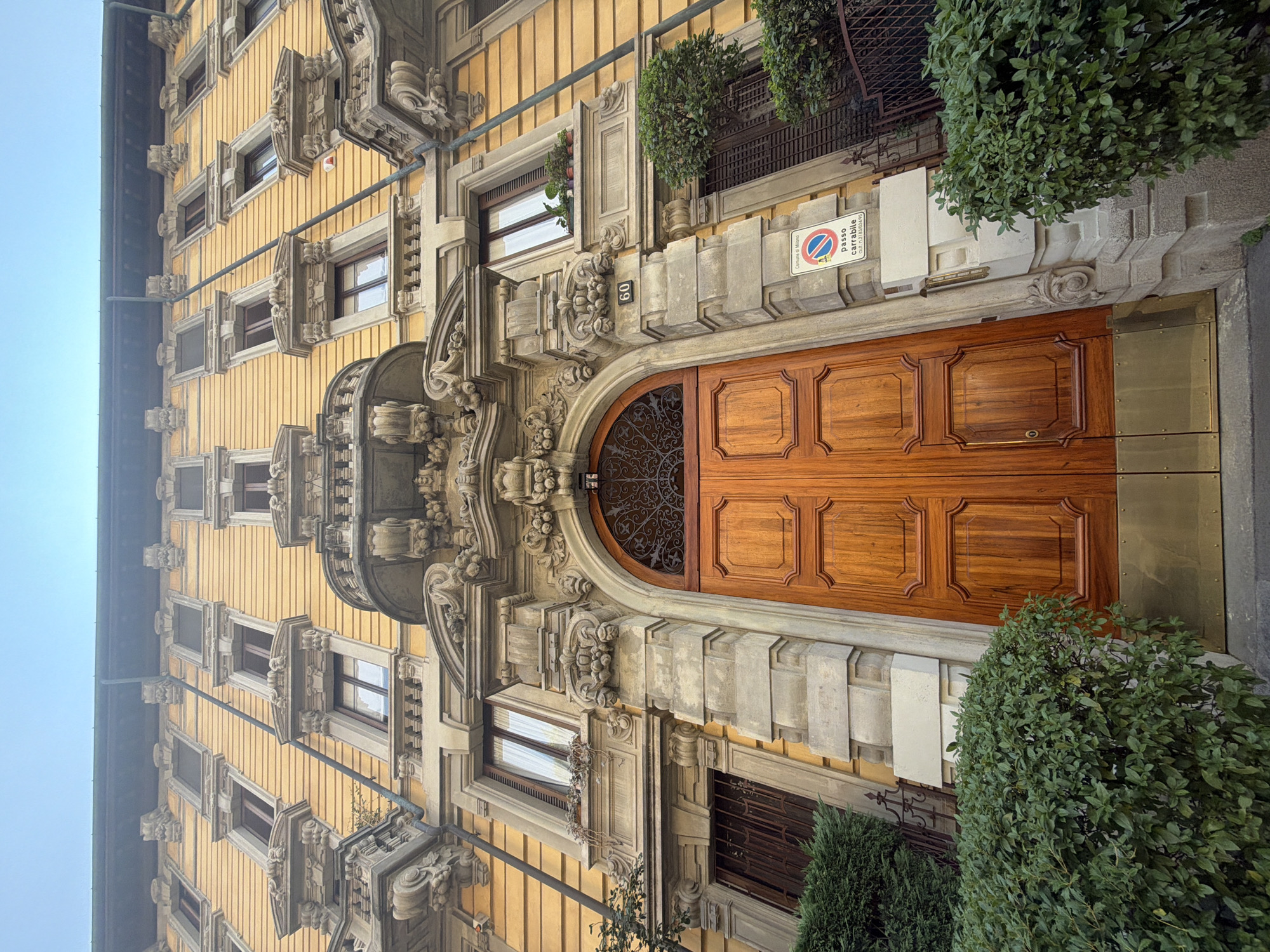 Ornate yellow building on Via Visconti, Milan