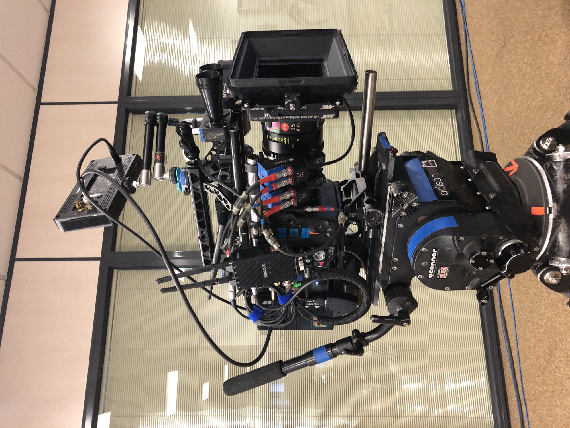 Film crew sets up professional camera equipment in Madrid suburb