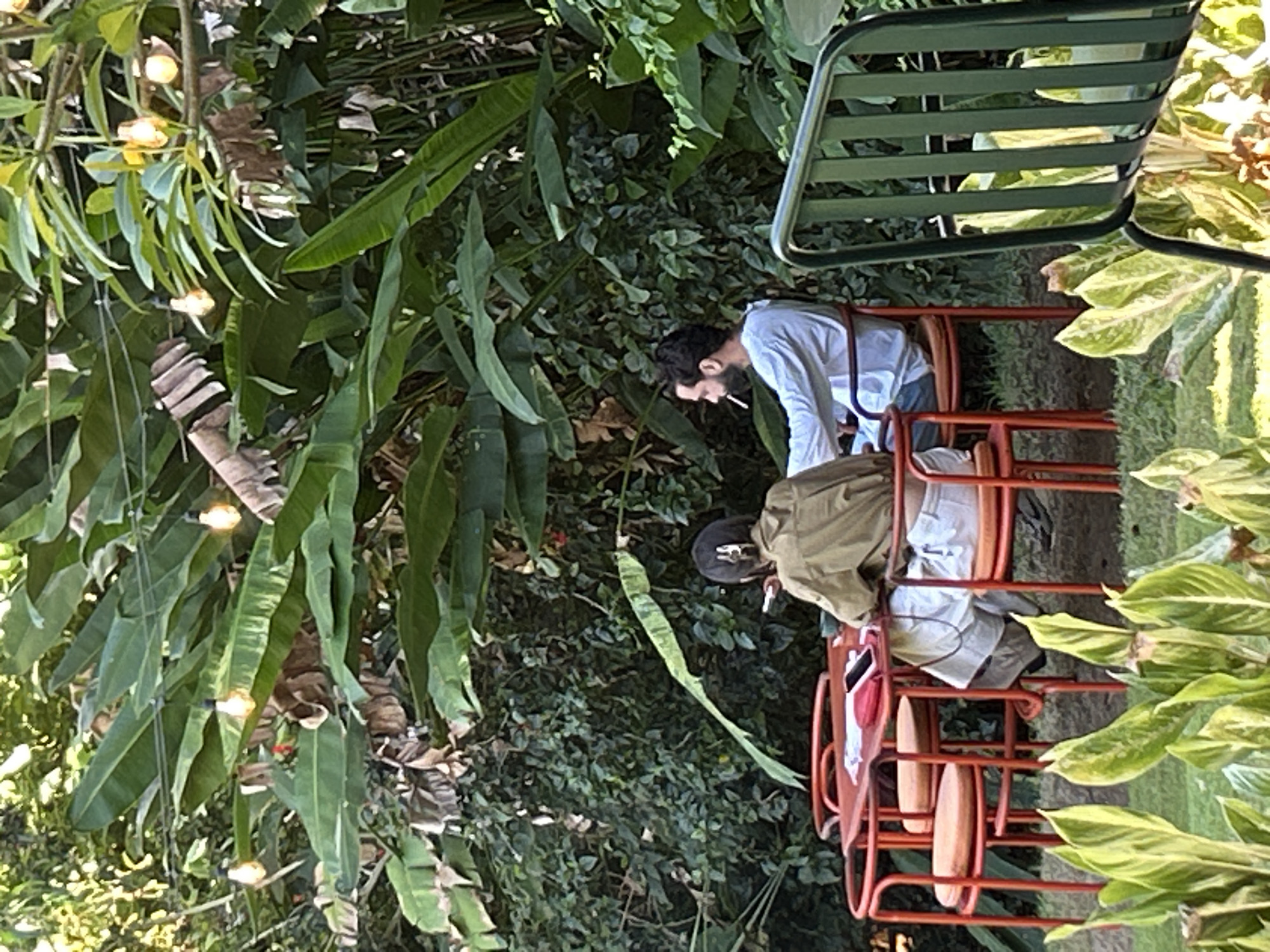 Busy café-resort day in Mengwi, Bali — art, coffee, and full tables