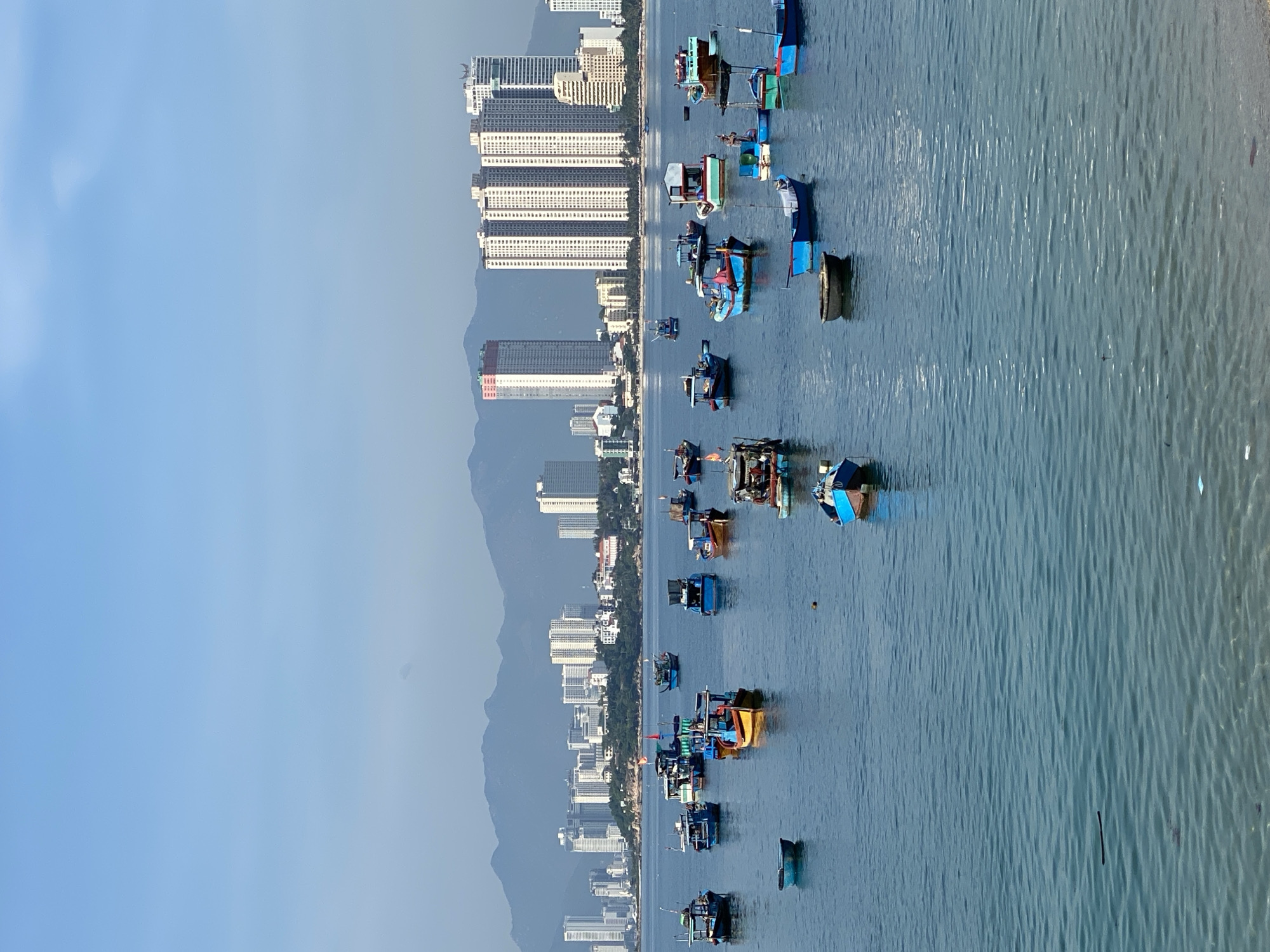 Nha Trang bay, construction sites, and scattered broken glass