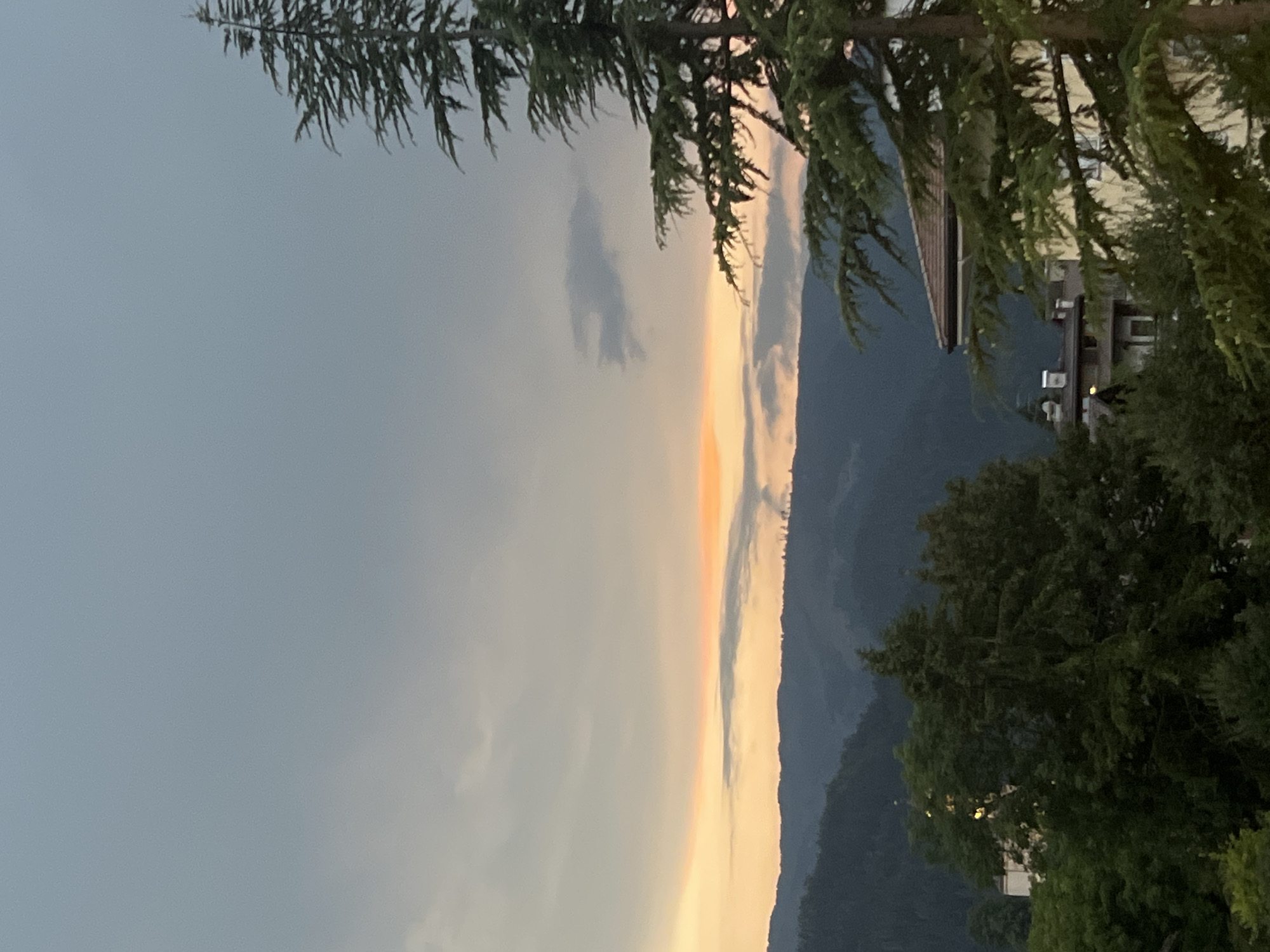 Dusk over Castello di Fiemme, solar panels and Alpine skyline