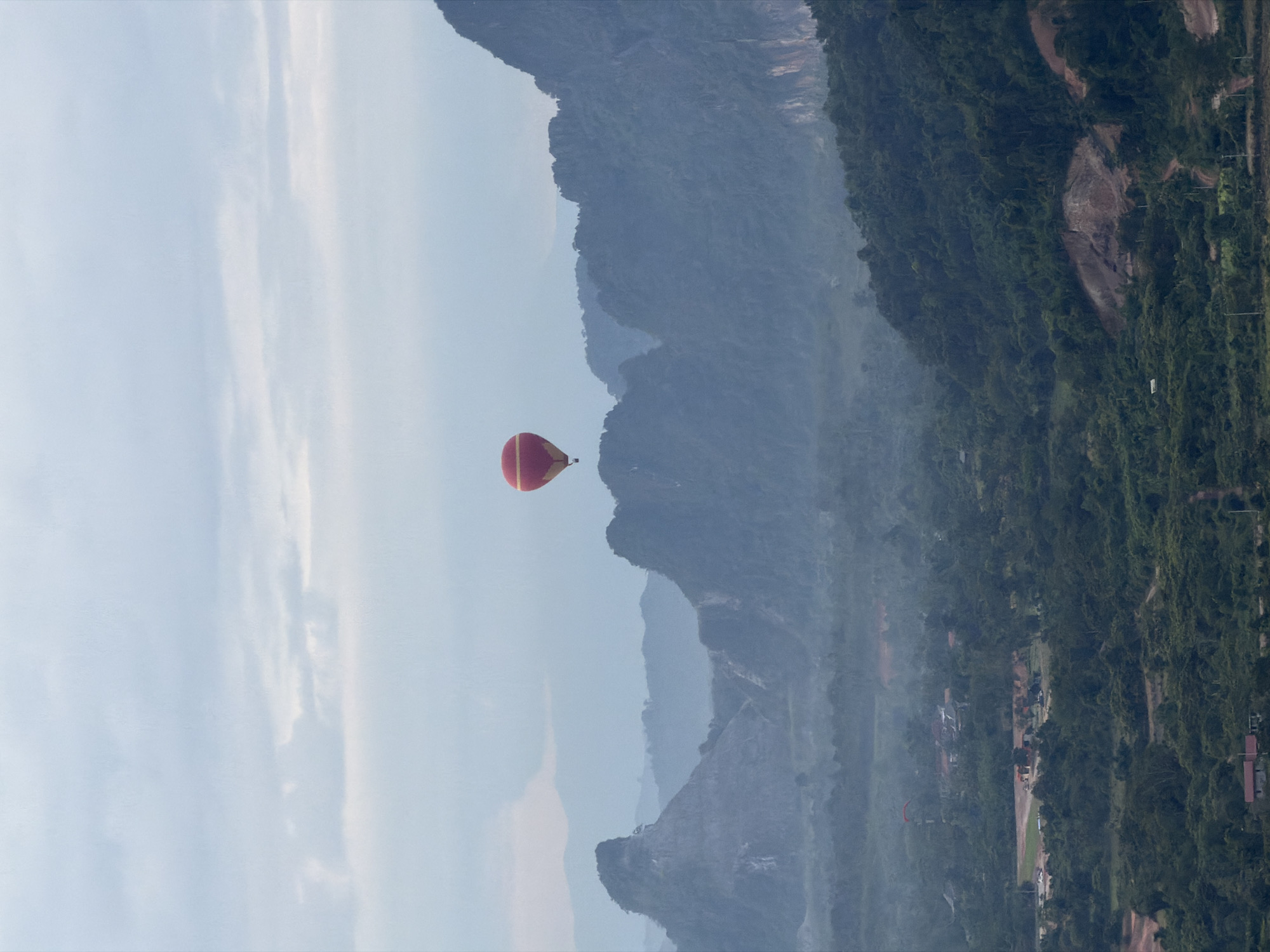 Hot air ballooning over Laos limestone karst country