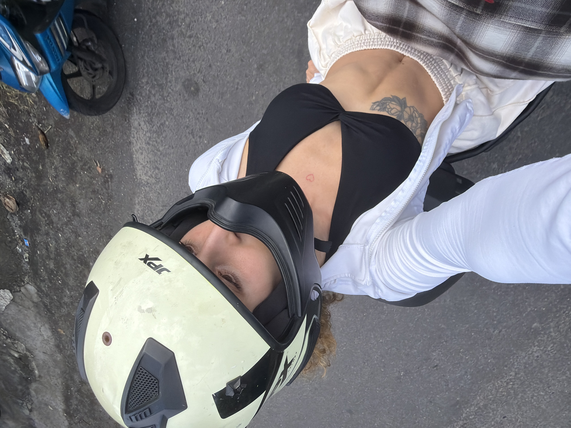 Woman on scooter spotted in Mengwi, Indonesia morning hours