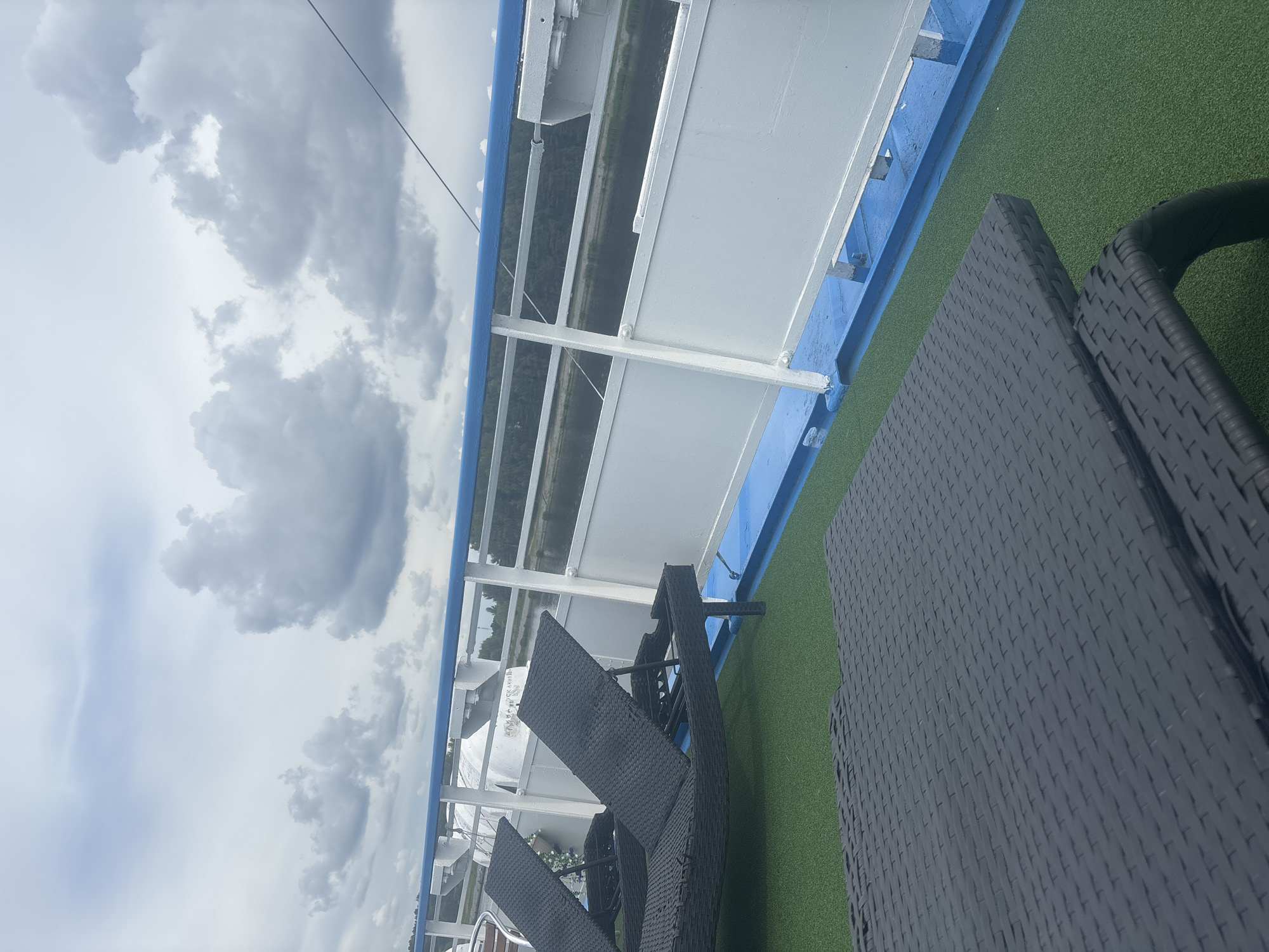 River cruise past a submerged bell tower, with casual deck moments