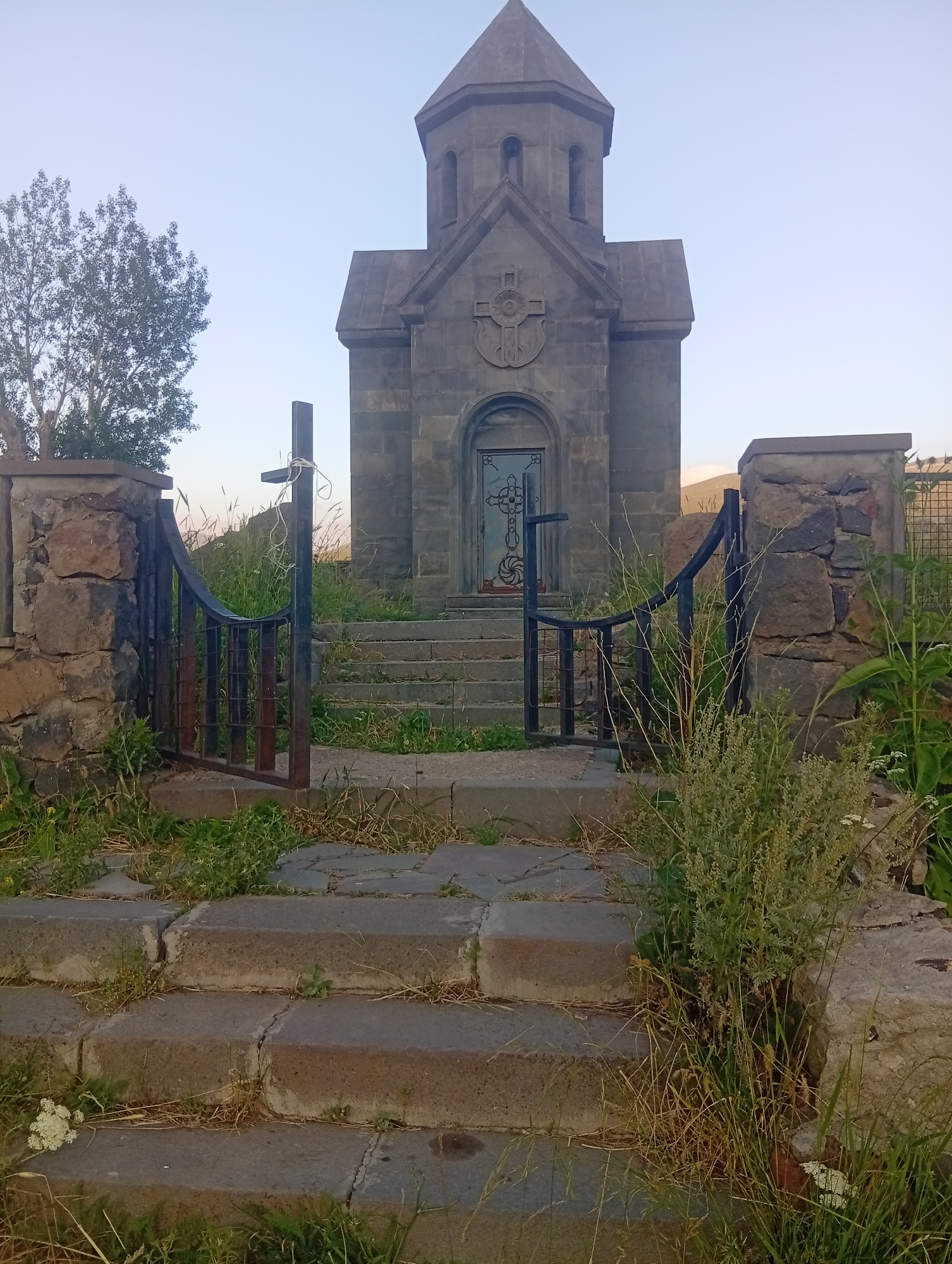Stone chapel meets still water at Kechut Reservoir, Armenia